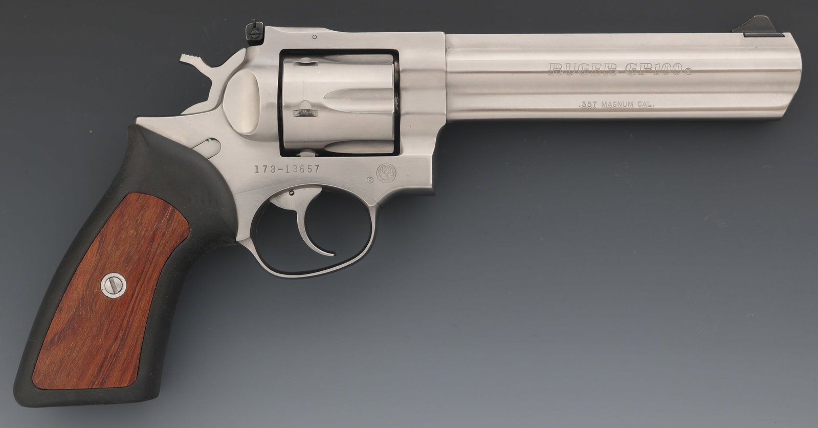 RUGER MODEL GP100 .357 MAGNUM CALIBER DA REVOLVER: RUGER MODEL GP100 .357 MAGNUM CALIBER DA REVOLVER Ruger Model GP100 .357 Magnum caliber DA revolver. Blade front sight. Adjustable rear sight. Six-shot fluted cylinder. Rubber and wood grips. Caliber 