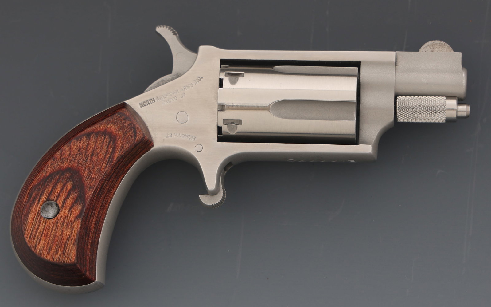 NORTH AMERICAN ARMS MODEL NAA-22MS .22 REVOLVER: NORTH AMERICAN ARMS MODEL NAA-22MS .22 REVOLVER North American Arms Model NAA-22MS .22 Magnum SA revolver. Fixed sights. Five-shot fluted cylinder. Wood grips. Caliber / Gauge: 22 Magnum Barrel Length