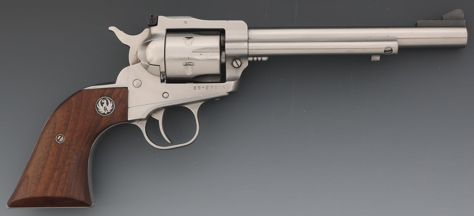 RUGER NEW MODEL SINGLE-SIX .22 LR CALIBER REVOLVER: RUGER NEW MODEL SINGLE-SIX .22 LR CALIBER REVOLVER Ruger New Model Single-Six .22 LR caliber SA revolver. Blade front sight. Adjustable rear sight. Six-shot fluted cylinder. Wood grips with Ruger meda