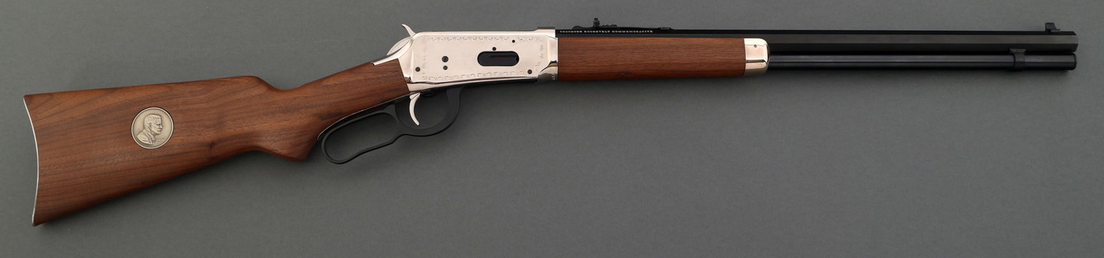 WINCHESTER 94 ROOSEVELT COMMEMORATIVE CARBINE: WINCHESTER 94 ROOSEVELT COMMEMORATIVE CARBINE 1969 Winchester model 94 Theodore Roosevelt Commemorative 30-30 caliber carbine. 20" octagonal barrel. Blued finish. Adjustable rear sight. Engraved recei