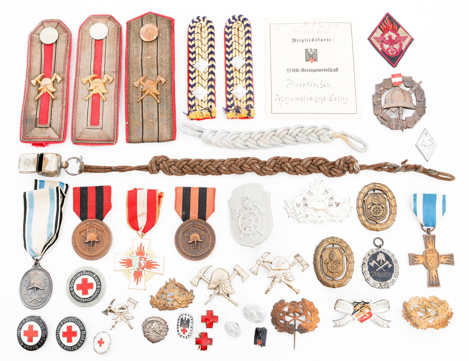 WWII GERMAN FIRE POLICE & RED CROSS INSIGNIA: WWII GERMAN FIRE POLICE & RED CROSS INSIGNIA WWII German Fire Police and Red Cross Insignia. Includes Shoulder Boards, Pins, Medals, Badges, Buttons, Whistle Lanyard and more. Provenance: Lifetime Edg