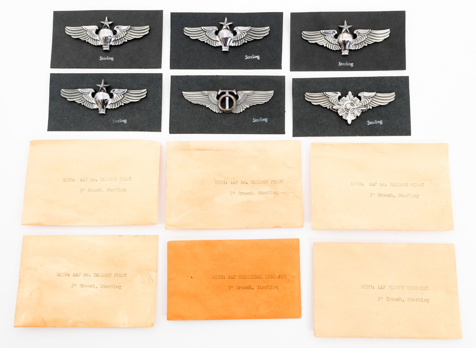 WWII USAAF OBSERVER, BALLOON & ENGINEER WINGS: WWII USAAF OBSERVER, BALLOON & ENGINEER WINGS WWII USAAF Pilot Wings. Maker marked by LGB and marked Sterling. Includes original packing. (1) Technical Observer. (4) Senior Balloon Pilot. (1) Flight E