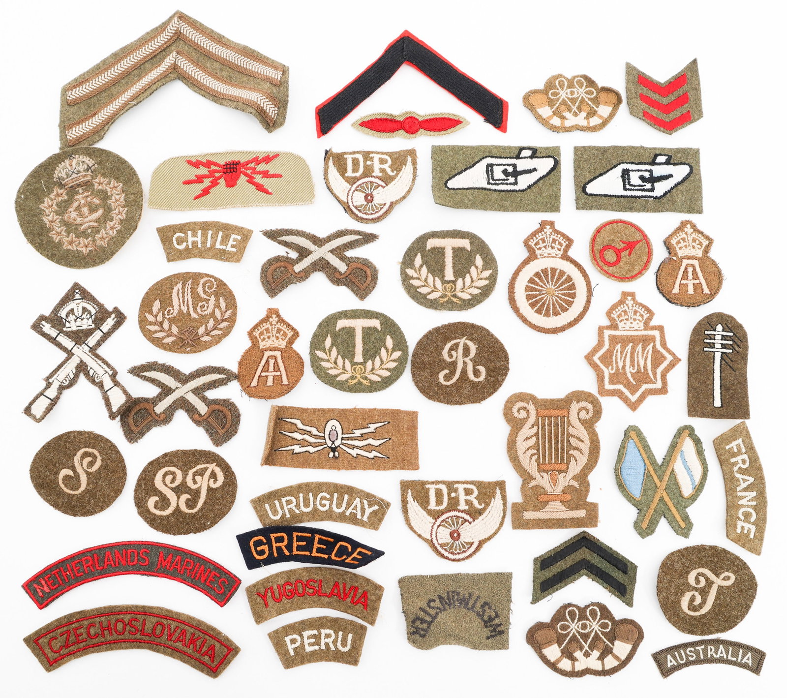 WWII BRITISH FOREIGN VOL. TABS & TRADE PATCHES: WWII BRITISH FOREIGN VOL. TABS & TRADE PATCHES WWII British Foreign Volunteer Tabs & Trade Patches. Includes foreign volunteer shoulder tabs, Tank Crew patches, physical training instructor, Signaler,