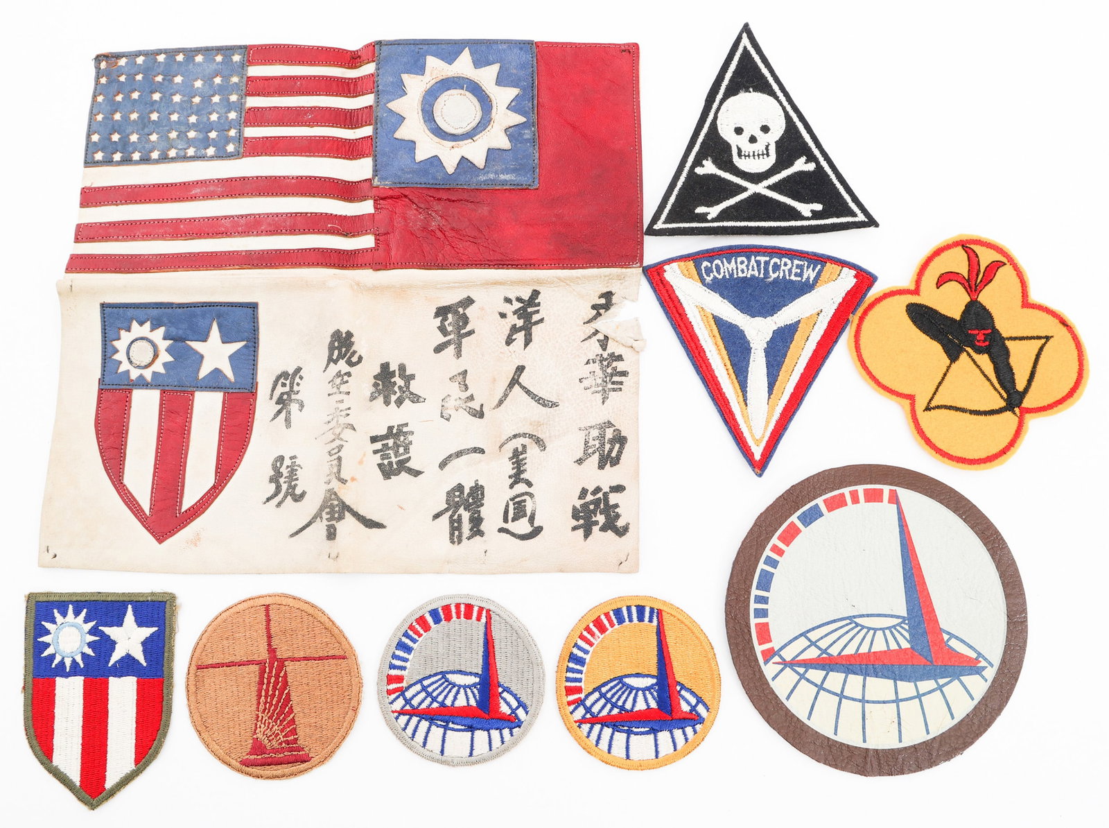 WWII CBI LEATHER BLOOD CHIT & USAAF PATCHES: WWII CBI LEATHER BLOOD CHIT & USAAF PATCHES WWII CBI Blood Chit and USAAF Patches. (1) Theater Made Blood Chit. Multi-piece, painted leather construction. Painted Chinese characters and patches. (1) 4