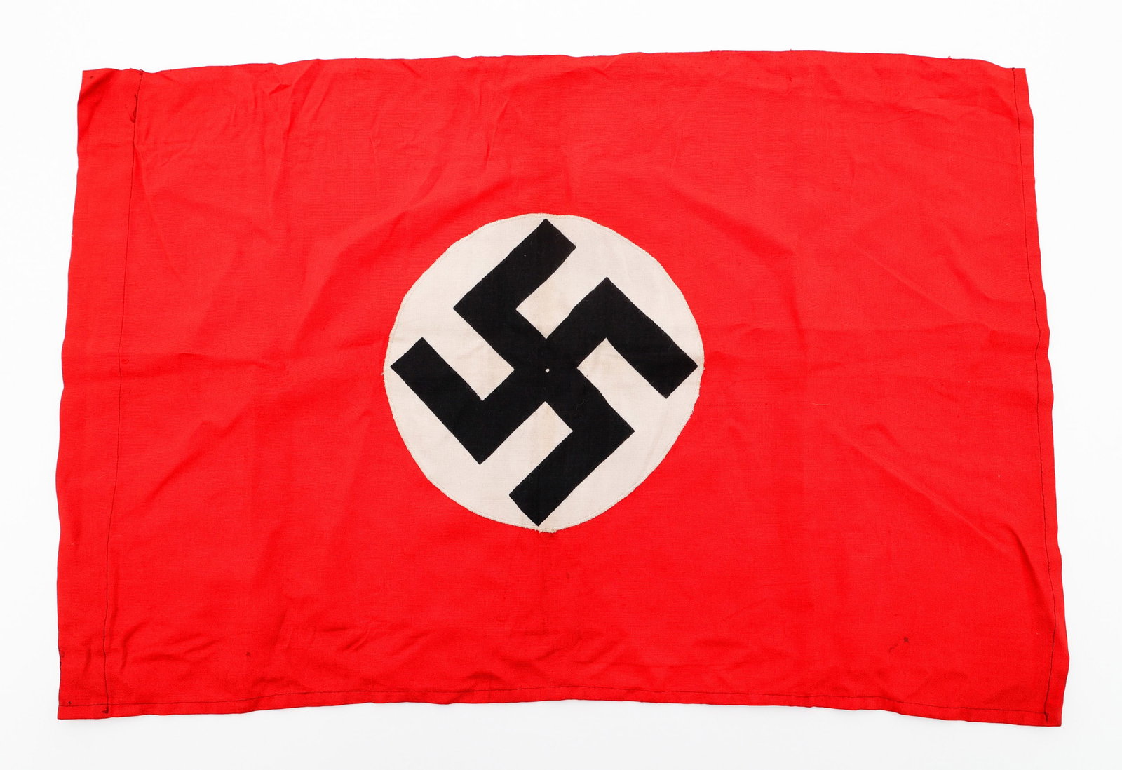 WWII GERMAN NSDAP FLAG: WWII GERMAN NSDAP FLAG WWII German NSDAP Flag. Double sided, multi-piece white on red cotton construction with printed mobile swastika. No visible marks. Size: 15" x 22"