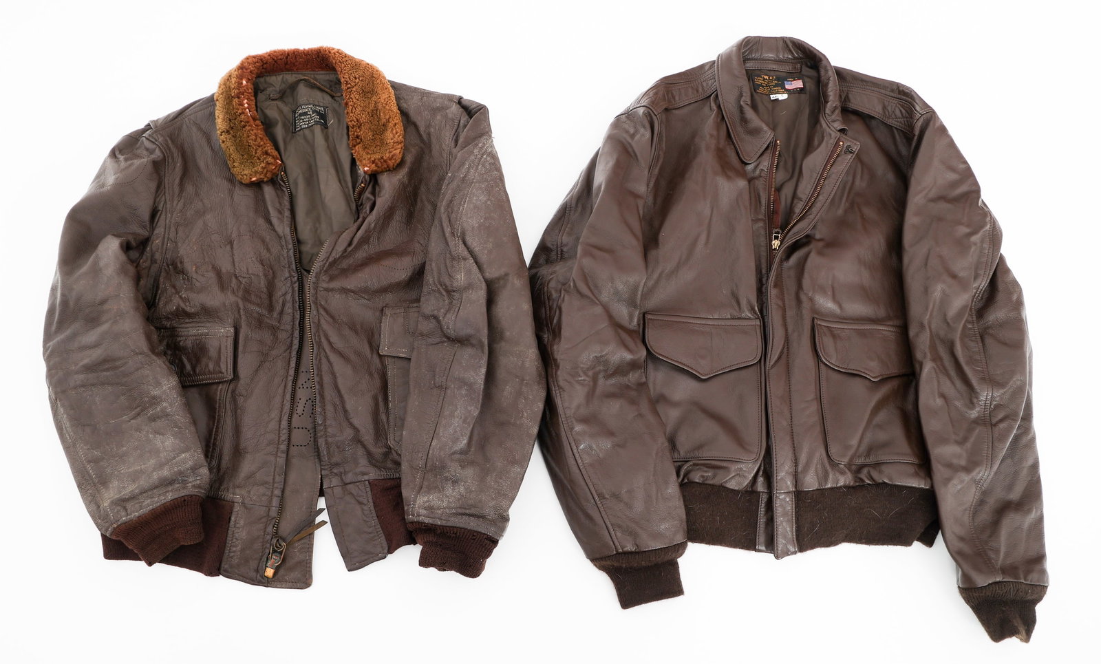 VIETNAM WAR - CURRENT US TYPE G1 & A2 JACKETS: VIETNAM WAR - CURRENT US TYPE G1 & A2 JACKETS Vietnam War - Current US Type G1 and A2 Leather Flight Jackets. (1) Type G1 Jacket. Brown leather with fur lined collar. Nine patches have been removed fr