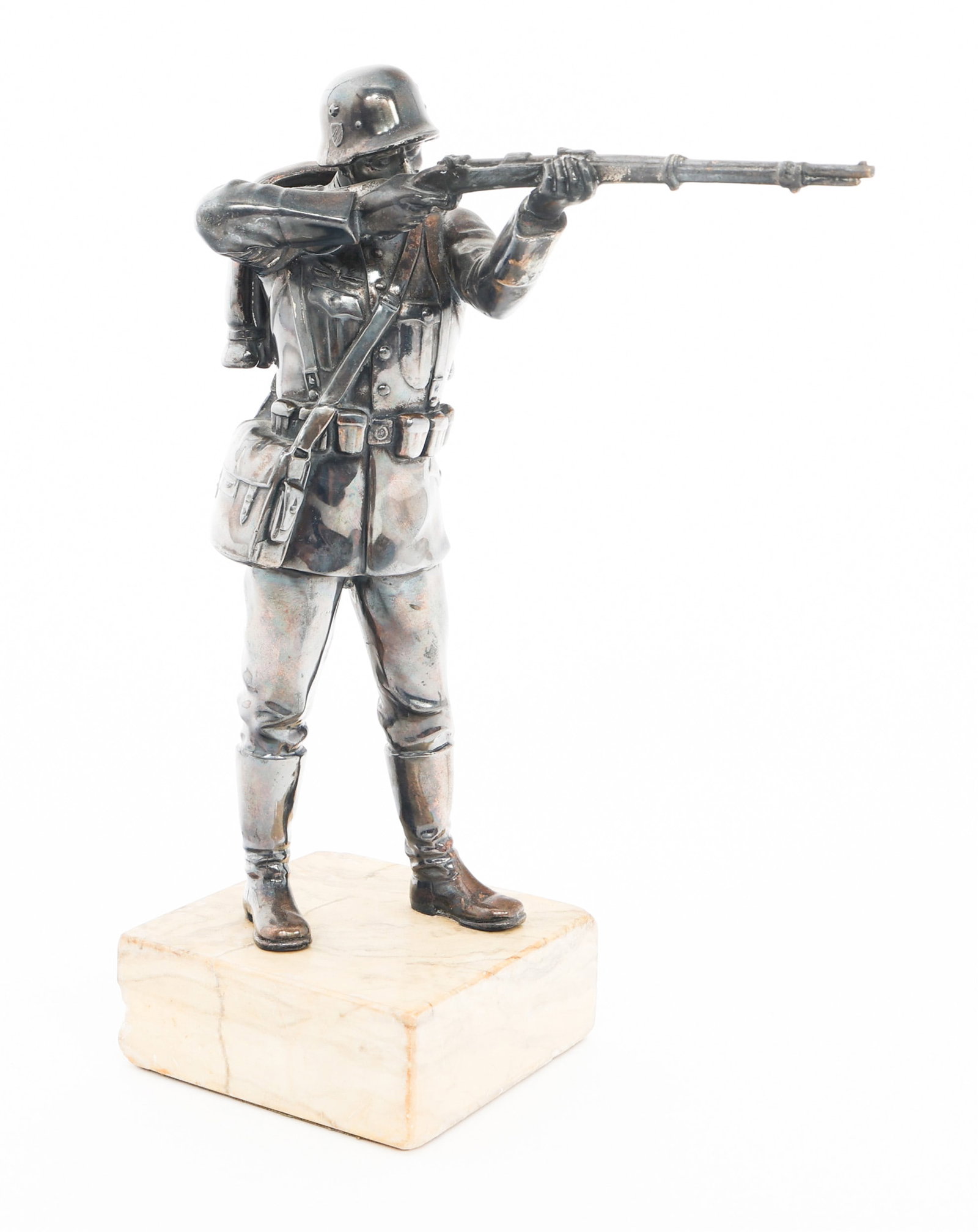 WWII GERMAN SOLDIER SILVER PLATED DISPLAY STATUE: WWII GERMAN SOLDIER SILVER PLATED DISPLAY STATUE WWII German Soldier Desk Display Statue. Silver plated alloy construction with granite base. No visible maker's marks. Size: 4" x 4" x 11 1/2" Weight:
