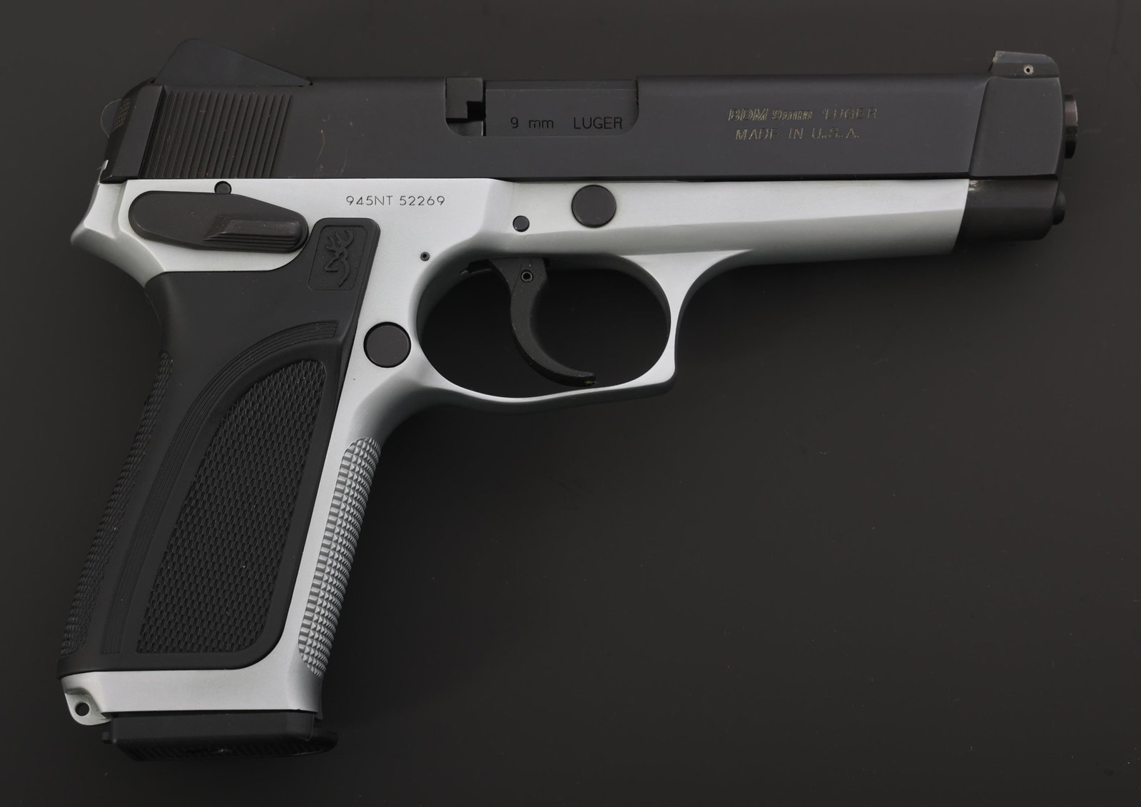 BROWNING MODEL BDM 9x19mm CALIBER PISTOL: BROWNING MODEL BDM 9x19mm CALIBER PISTOL Browning Model BDM 9x19mm caliber semi-automatic pistol. Checkered Browning polymer grips. Fixed sights. Two magazines. Browning hard plastic case with literat