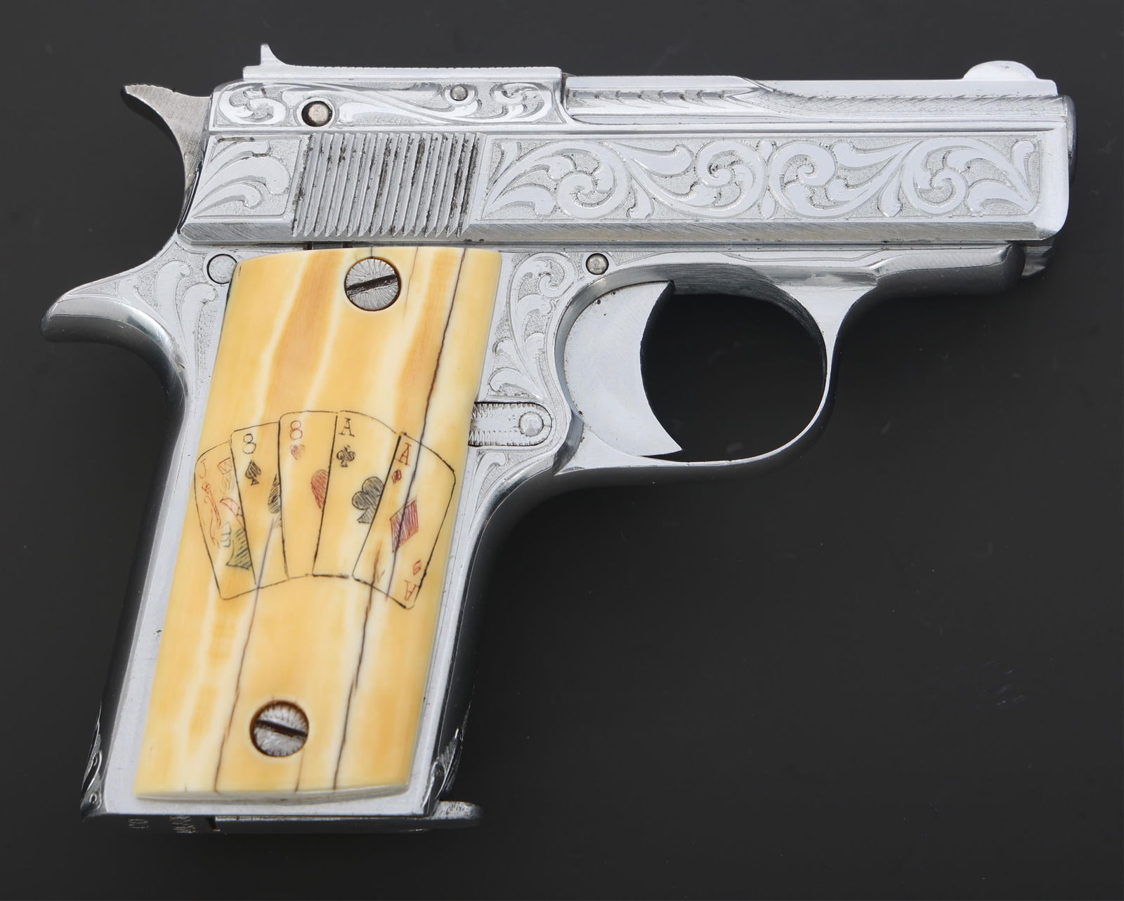 ENGRAVED STAR MODEL CO 6.35mm CALIBER PISTOL: ENGRAVED STAR MODEL CO 6.35mm CALIBER PISTOL Engraved Star Model CO 6.35mm caliber semi automatic pistol. Scroll engraving throughout. Left slide engraved STAR Cal 6.35 (25). Horn grips with playing c