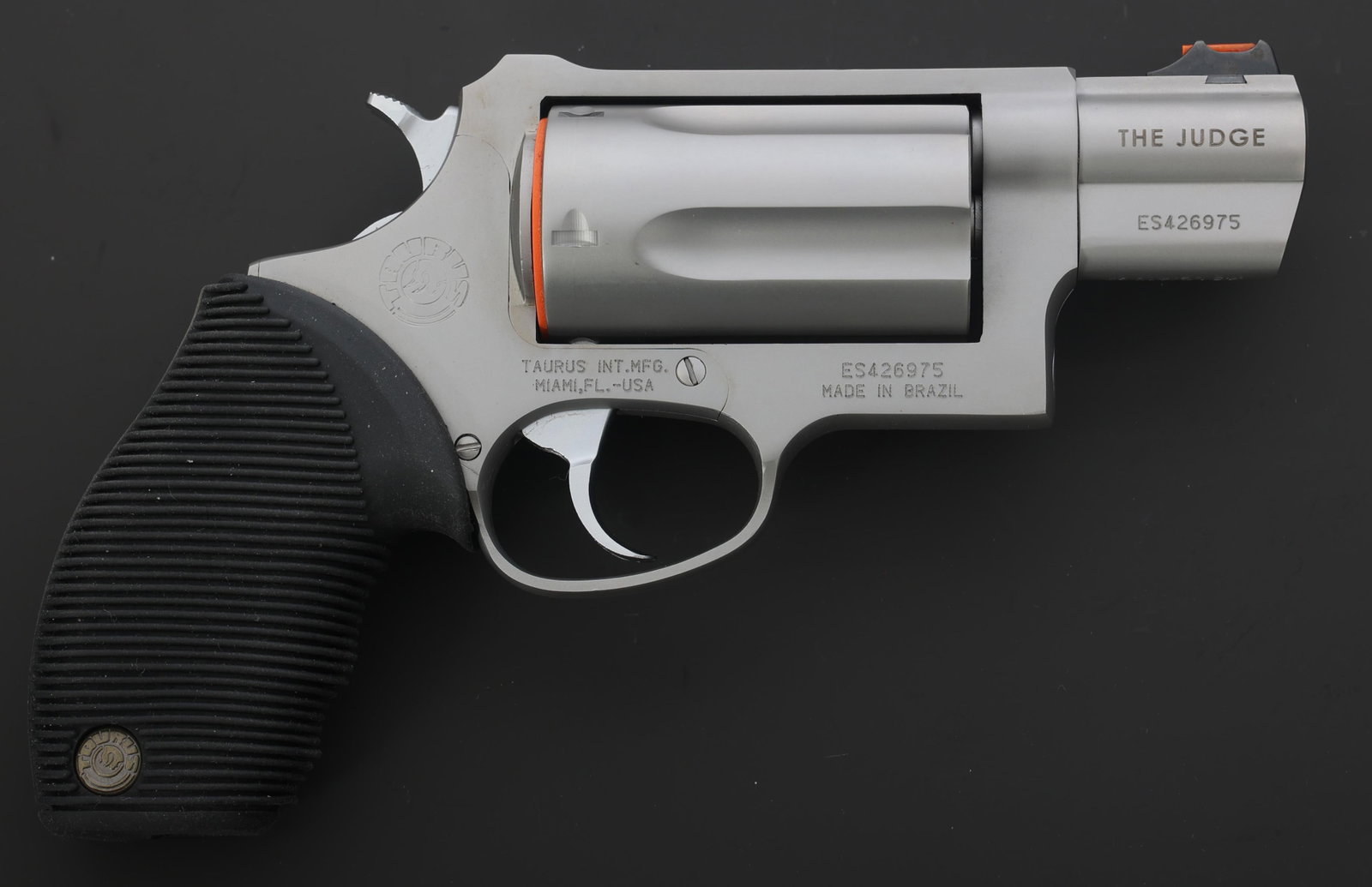 TAURUS MODEL THE JUDGE .45 LC / .410 GA REVOLVER: TAURUS MODEL THE JUDGE .45 LC / .410 GA REVOLVER Taurus Model The Judge .45 LC / .410 gauge DA revolver. Top strap laser engraved Public Defender. Red fiber front sight. Square notch rear sight. Five 