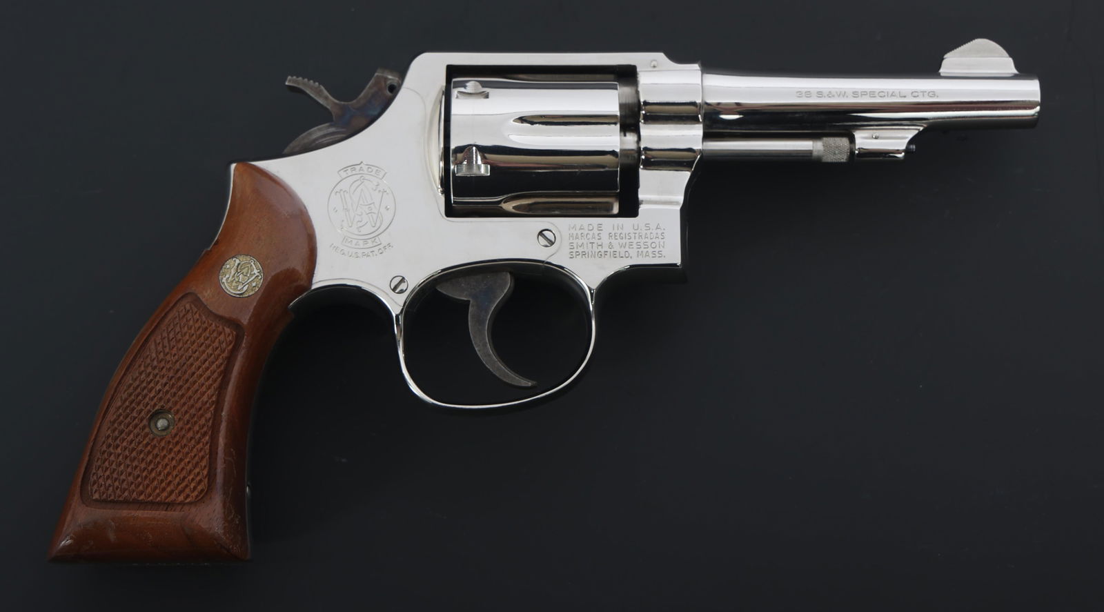 SMITH & WESSON MODEL 10-5 .38 SPECIAL CAL REVOLVER: SMITH & WESSON MODEL 10-5 .38 SPECIAL CAL REVOLVER Smith & Wesson Model 10-5 .38 S&W Special caliber DA revolver. Six-shot fluted cylinder. Checkered wood grips with S&W medallions. Fixed sights. Card