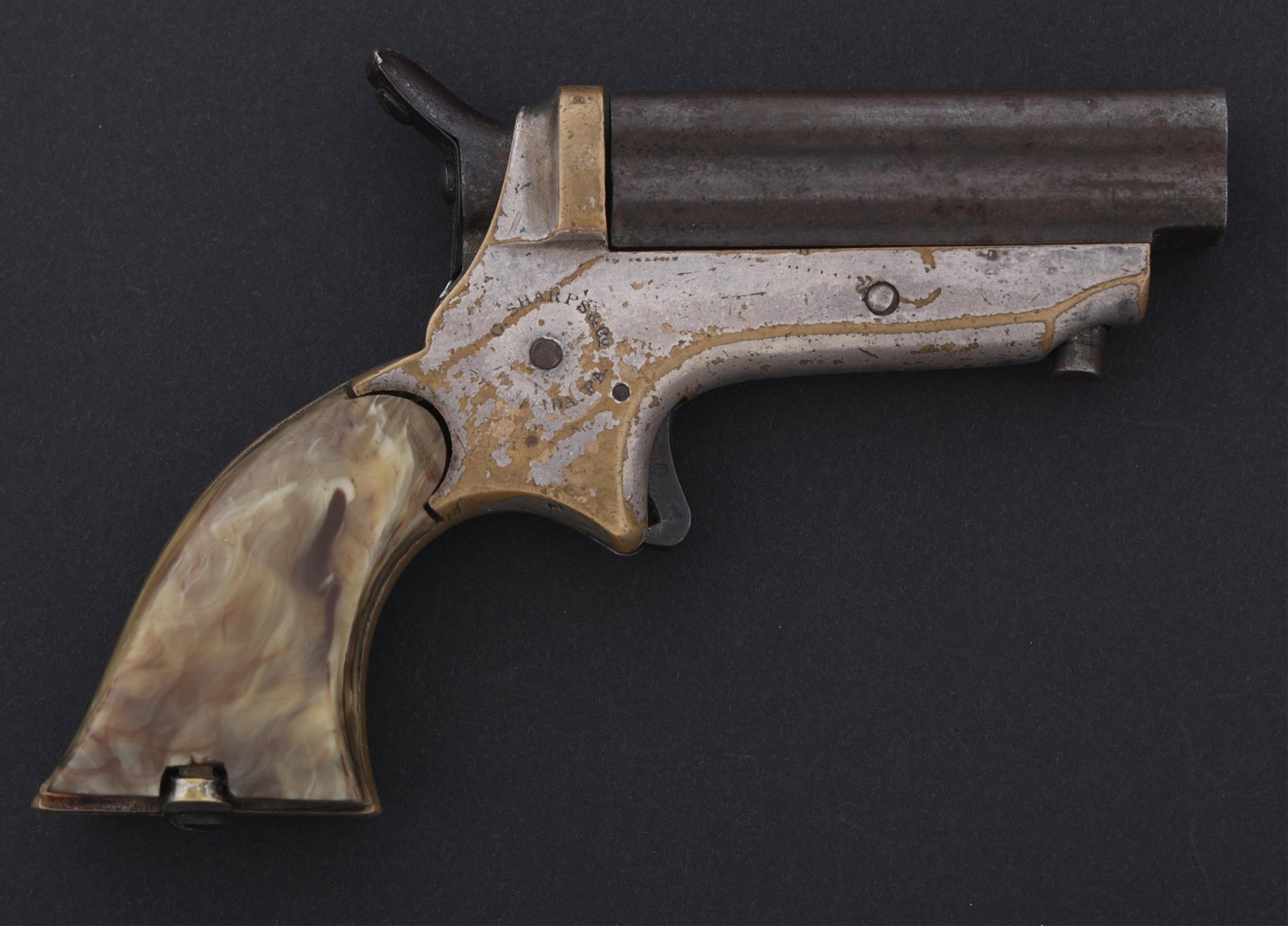C. SHARPS MODEL 1C .22 CALIBER PEPPERBOX PISTOL: C. SHARPS MODEL 1C .22 CALIBER PEPPERBOX PISTOL C. Sharps Model 1C .22 caliber pepperbox pistol. Serial numbers match on butt frame and barrel. Nickel plated brass frame. Composite grips. Caliber / Ga