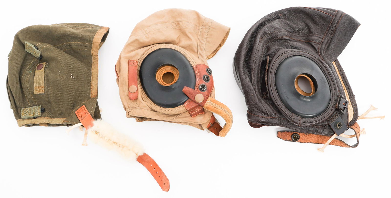 WWII USAAF TYPE A-9 & AN-H-15 & USN FLYING HELMETS: WWII USAAF TYPE A-9 & AN-H-15 & USN FLYING HELMETS WWII USAAF and US Navy Flying Helmets. (1) Type A-9. OD green cotton construction. Fleece ear cups and chinstrap pad. Army Air Forces contract tag pr