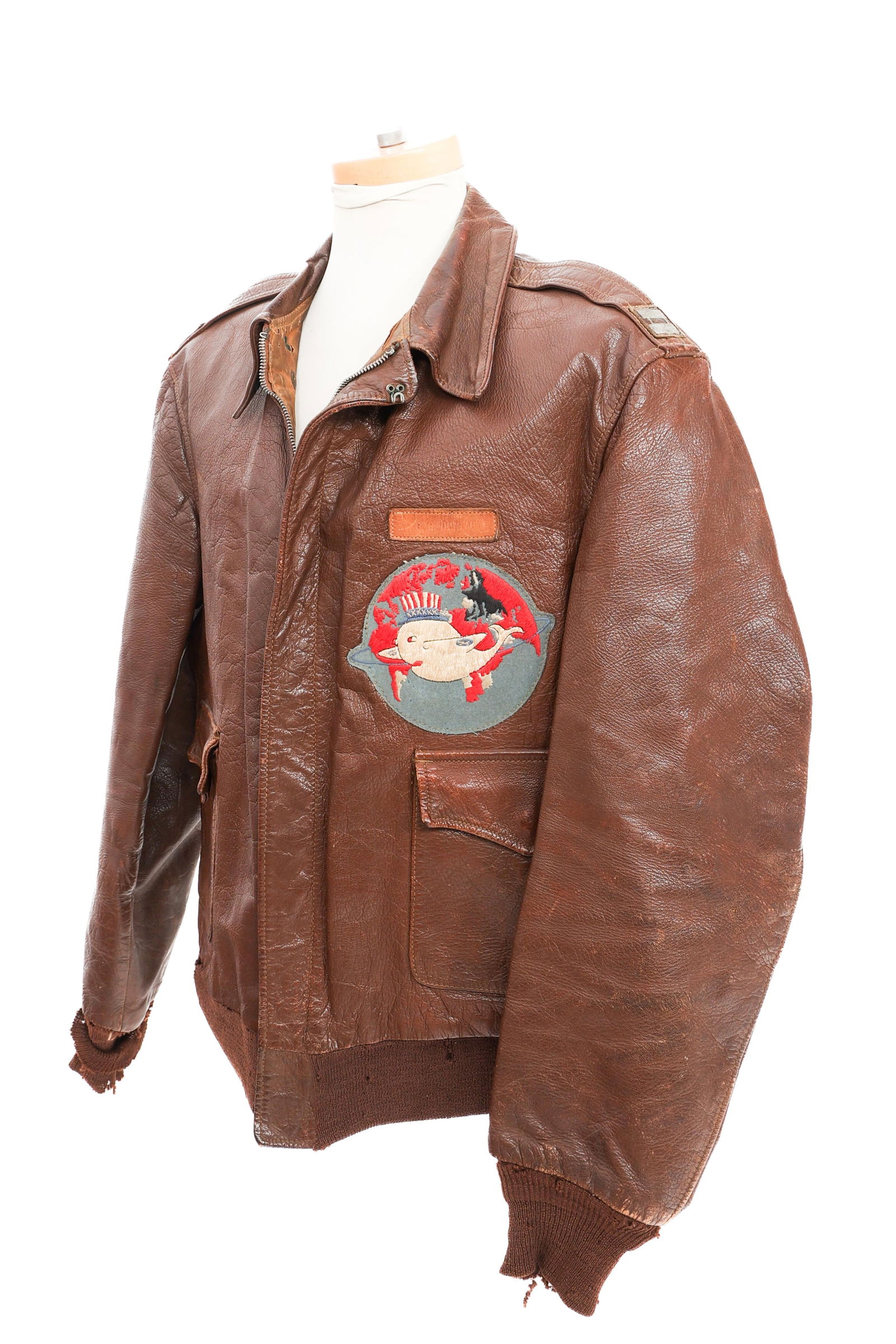 WWII USAAF 328th BS NAMED TYPE A-2 FLIGHT JACKET: WWII USAAF 328th BS NAMED TYPE A-2 FLIGHT JACKET WWII USAAF 328th Bombardment Squadron, 93rd Bomb Group, 8th Air Force Type A-2 Flight Jacket. Named to Captain G.R. Dunlap. Brown leather construction.