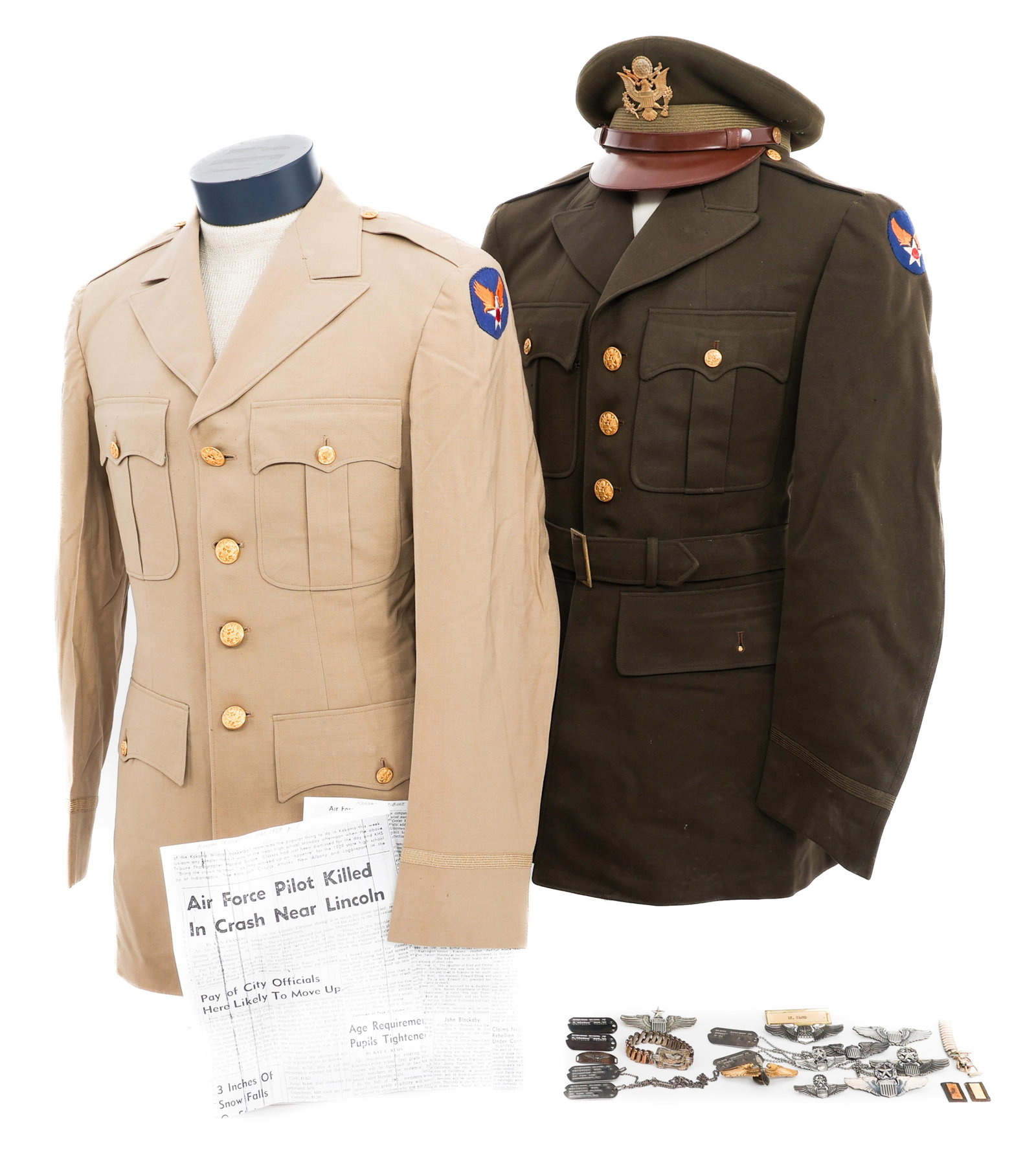 WWII - COLD WAR USAAF NAMED PILOT UNIFORM GROUPING: WWII - COLD WAR USAAF NAMED PILOT UNIFORM GROUPING WWII - Cold War USAAF Pilot's Grouping and Tunics. Named to Lieutenant Carlton Cloud Jr. (1) WWII USAAF OD elastique tunic. (1) Summer Khaki USAAF el