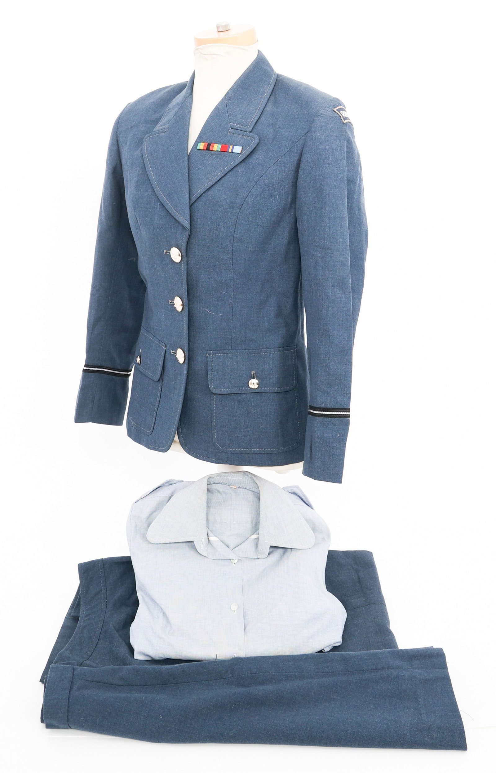 BUSH WAR RHODESIAN UDI AF WOMEN'S OFFICER UNIFORM: BUSH WAR RHODESIAN UDI AF WOMEN'S OFFICER UNIFORM Bush War Rhodesian UDI Air Force Air Sub-Lieutenant Women's Uniform. (1) Air Sub-Lieutenant Tunic with ribbon bar. (1) Uniform shirt. (1) Pair of Trou