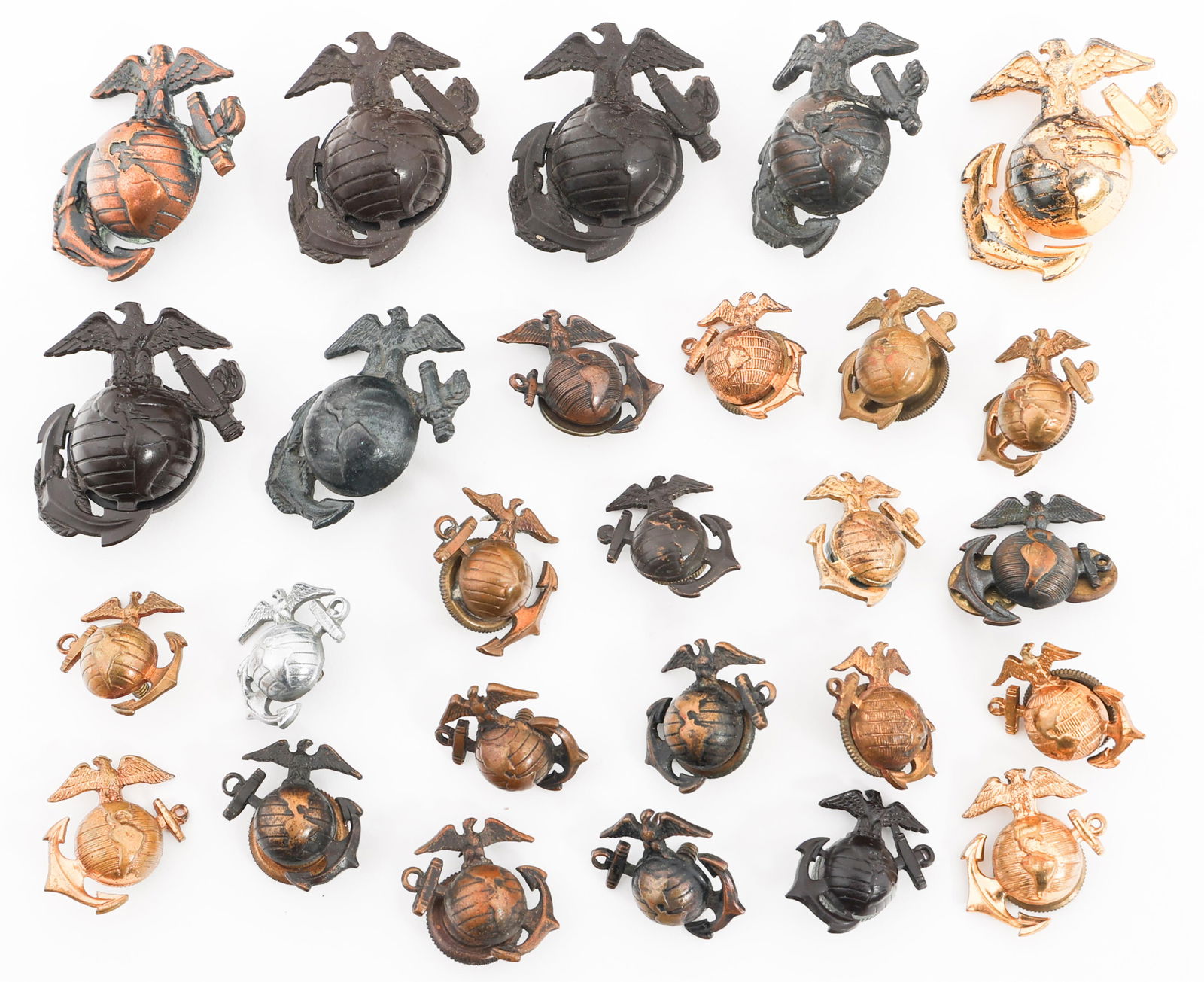 WWI USMC EM/NCO EGA COLLAR INSIGNIA & CAP BADGES: WWI USMC EM/NCO EGA COLLAR INSIGNIA & CAP BADGES P1937 US Marine Corps Enlisted Man/NCO EGA Collar Insignia and Cap Badges. Various maker marks. "Made in England" stamped on few. Provenance: Lifetime