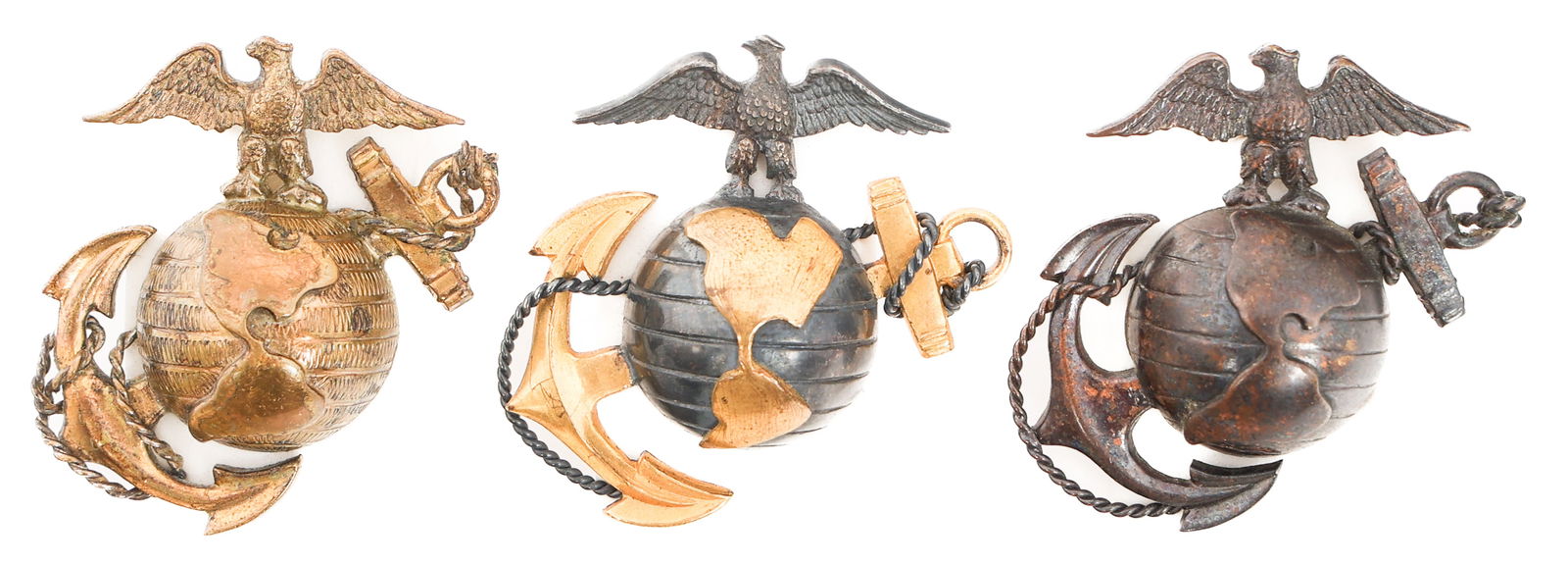 WWI USMC OFFICER DRESS & SERVICE EGA CAP BADGES: WWI USMC OFFICER DRESS & SERVICE EGA CAP BADGES P1912 USMC Officer Dress and Service EGA Cap Badges. (2) Dress EGA. One marked sterling and "Made in England". (1) Service EGA. Provenance: Lifetime Mil