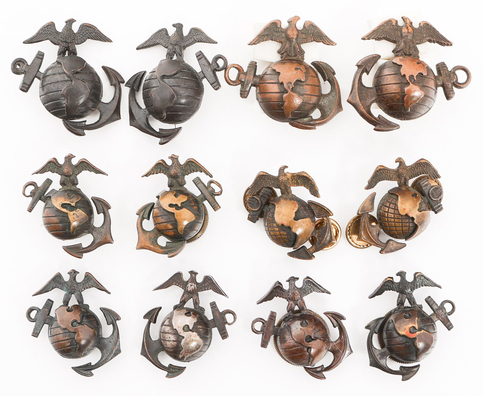 WWI - WWII USMC OFFICER EGA COLLAR INSIGNIA: WWI - WWII USMC OFFICER EGA COLLAR INSIGNIA USMC Officer EGA Collar Insignia Sets. (1) P1926 Droopy Wings. Marked "Fire Bronze". (2) P1912. One maker marked by Imperial, one marked Sterling. (1) P1937