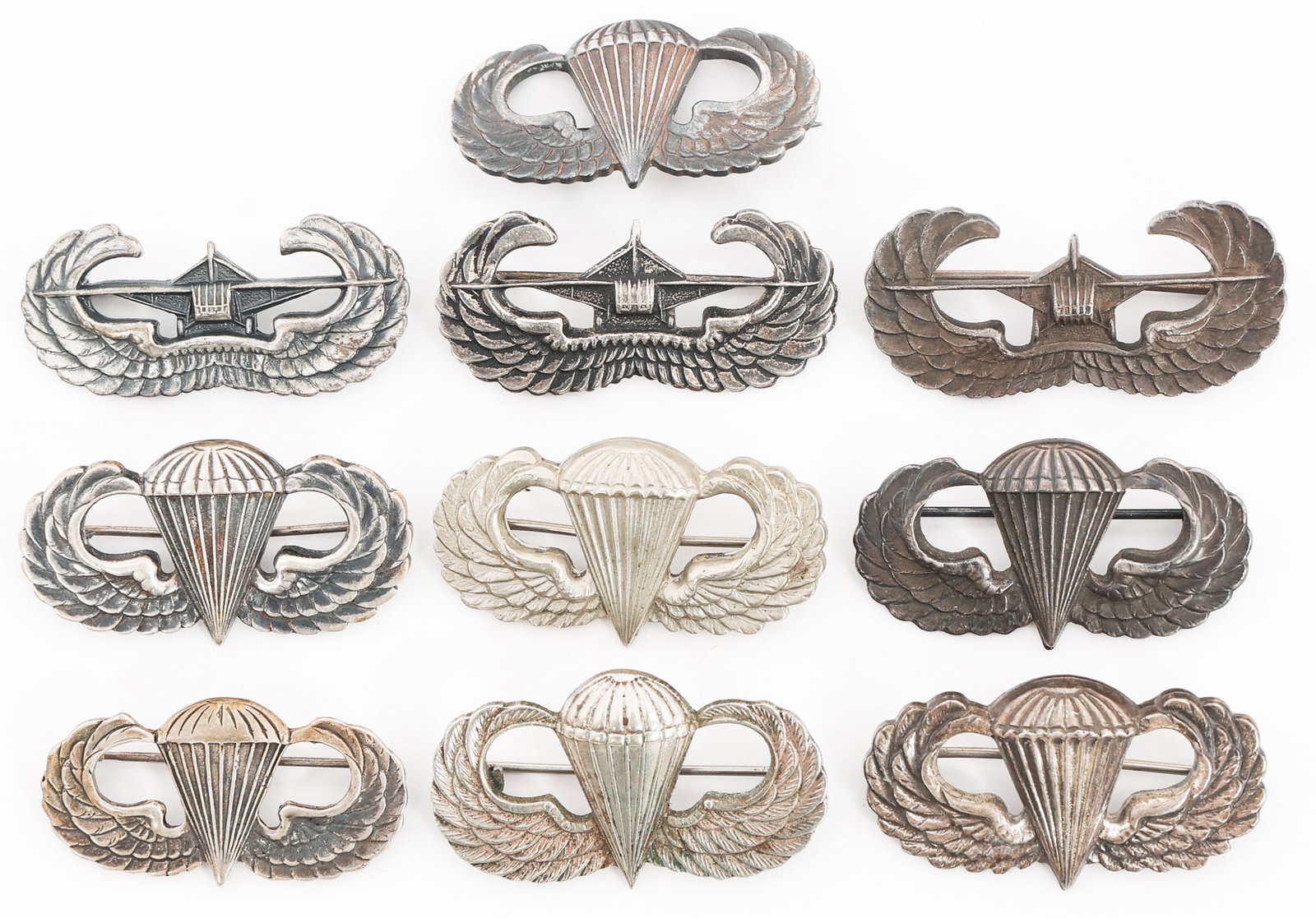 WWII US AIRBORNE PARATROOPER JUMP & GLIDER WINGS: WWII US AIRBORNE PARATROOPER JUMP & GLIDER WINGS WWII to Occupation US Army Airborne Jump and Glider Wings. Majority are marked Sterling. (1) Glider Wings. One is maker marked by Sendai Japan 1946. (7