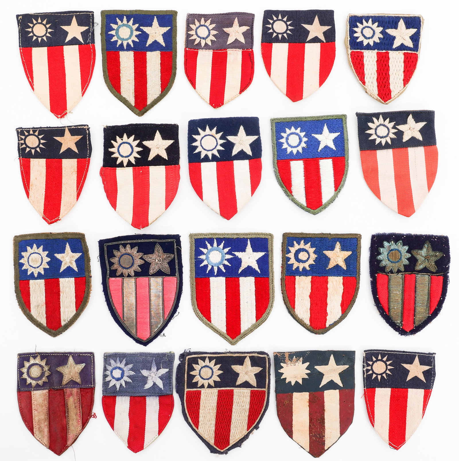 WWII USAAF CBI STANDARD & THEATER MADE PATCHES: WWII USAAF CBI STANDARD & THEATER MADE PATCHES WWII USAAF CBI Standard and Theater Made Patches. (4) Standard Issue. Full cotton embroidery. (15) Theater Made. Full cotton and bullion embroidery on fe