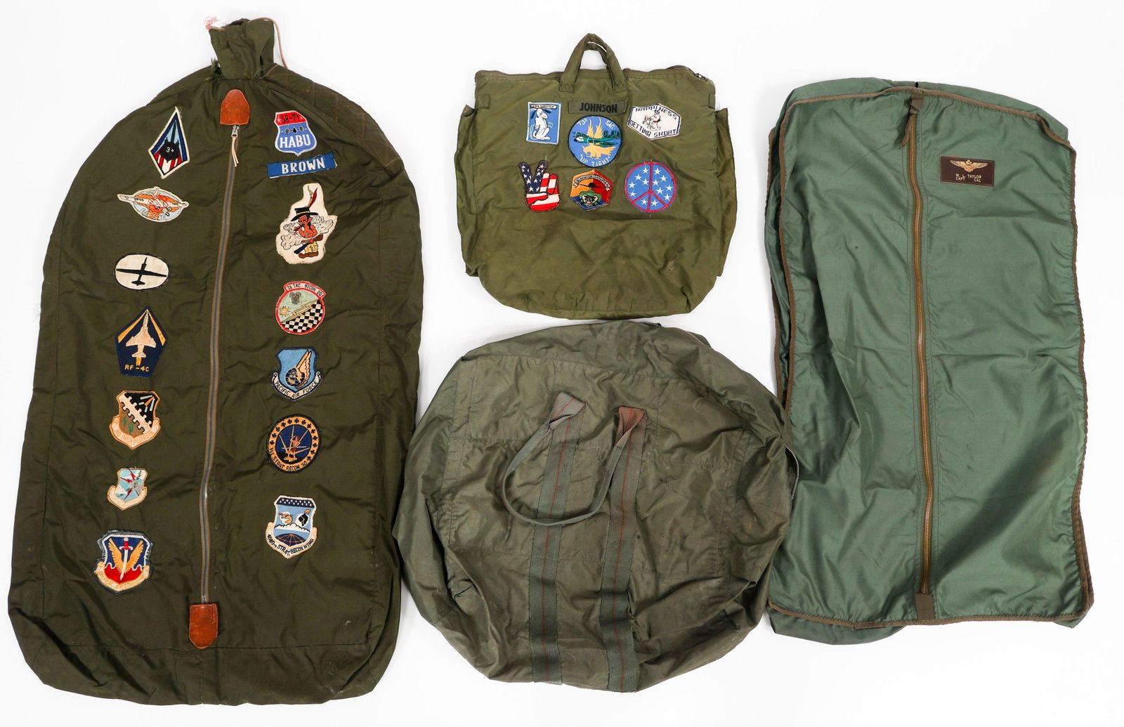 VIETNAM WAR US FLIGHT HELMET & UNIFORM BAGS: VIETNAM WAR US FLIGHT HELMET & UNIFORM BAGS Vietnam War US Armed Forces Flight Helmet & Uniform Carrying Bags. (1) Flight Helmet Carrying Bag. Unit and novelty patches on one side. (1) Flight Suit/Uni