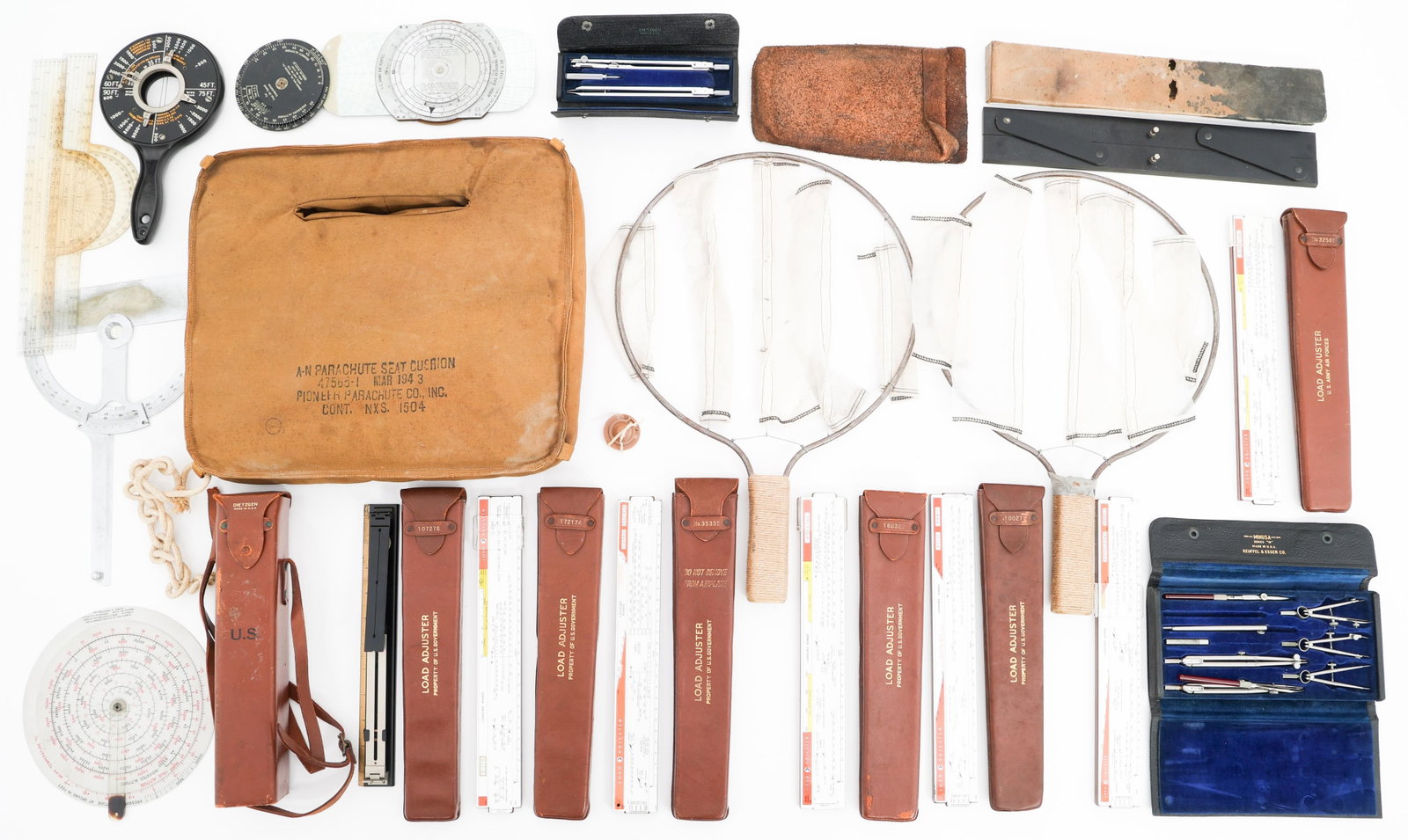 WWII USAAF & USN AVIATION EQUIPMENT & TOOLS: WWII USAAF & USN AVIATION EQUIPMENT & TOOLS WWII USAAF & USN Aviation Equipment & Tools. Includes AN-Parachute Seat Cushion dated 1943, US Navy AA Range Indicator dated 1944, landing signal paddles, U
