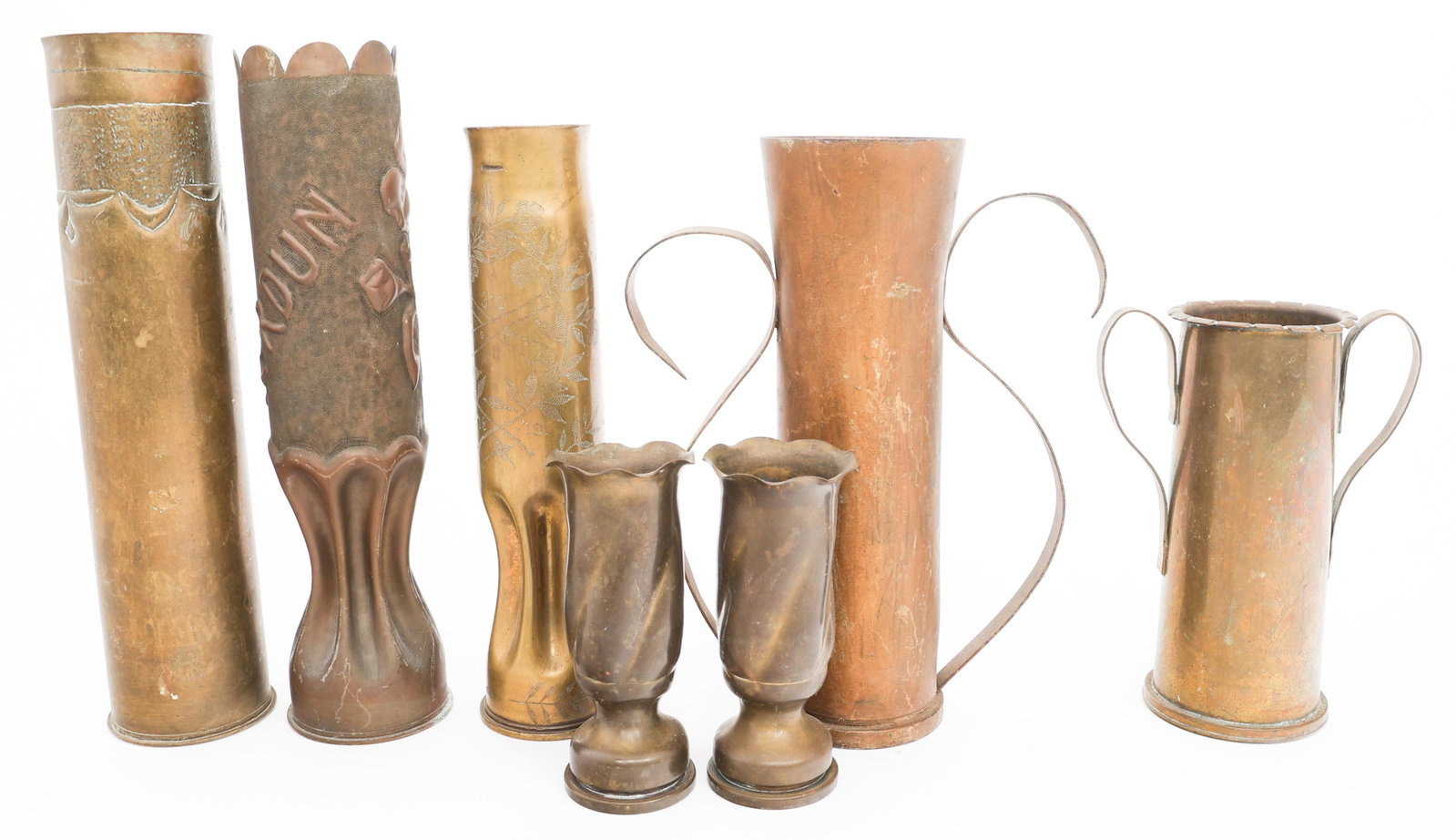 WWI - WWII US ARTILLERY SHELL TRENCH ART VASES: WWI - WWII US ARTILLERY SHELL TRENCH ART VASES WWI - WWII US Artillery Shell Trench Art Vases. Size: 6" to 13 3/4" Weight: 19 lbs. Provenance: Lifetime Military Memorabilia & Arms Collection of Peter 