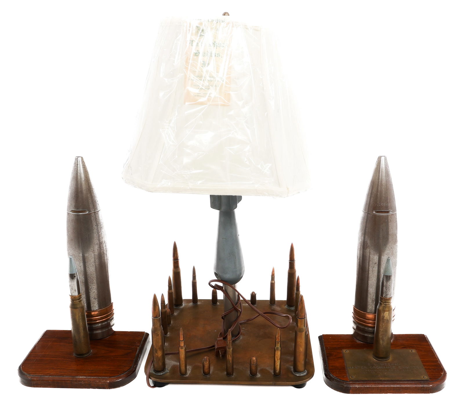 COLD WAR US ORDNANCE PRESENTATION PLAQUE & LAMP: COLD WAR US ORDNANCE PRESENTATION PLAQUE & LAMP Cold War US Ordnance Presentation Artillery Plaque Display and Lamp. (1) Two-Piece Presentation Display. Large shell with two 20mm rounds affixed to a w