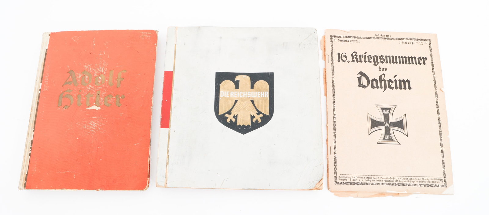 WWII GERMAN HITLER & DIEREICHSWEHR CIGARETTE ALBUM: WWII GERMAN HITLER & DIEREICHSWEHR CIGARETTE ALBUM WWII German Adolf Hitler and Diereichswehr Cigarette Albums and Magazine. (1) Adolf Hitler Album. Dated 1935. Complete. (1) Diereichswehr book. Dated