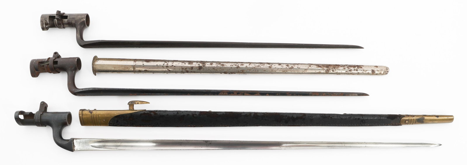 US M1873 & BRITISH P1895 SOCKET BAYONETS: US M1873 & BRITISH P1895 SOCKET BAYONETS US M1873 and British P1895 Socket Bayonets. (2) US M1873. Marked "US". One has scabbard. (1) P1895. Broad arrow and proof mark stamped. Leather scabbard with b