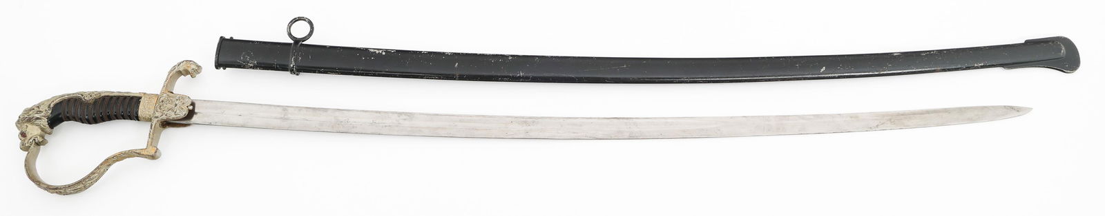IMPERIAL GERMAN CAVALRY OFFICER LION HEAD SWORD: IMPERIAL GERMAN CAVALRY OFFICER LION HEAD SWORD Imperial German Cavalry Officer Lion Head Sword. Single edged, slightly curved, bright blade. No visible marks. Leather buffer pad present. Decorated al