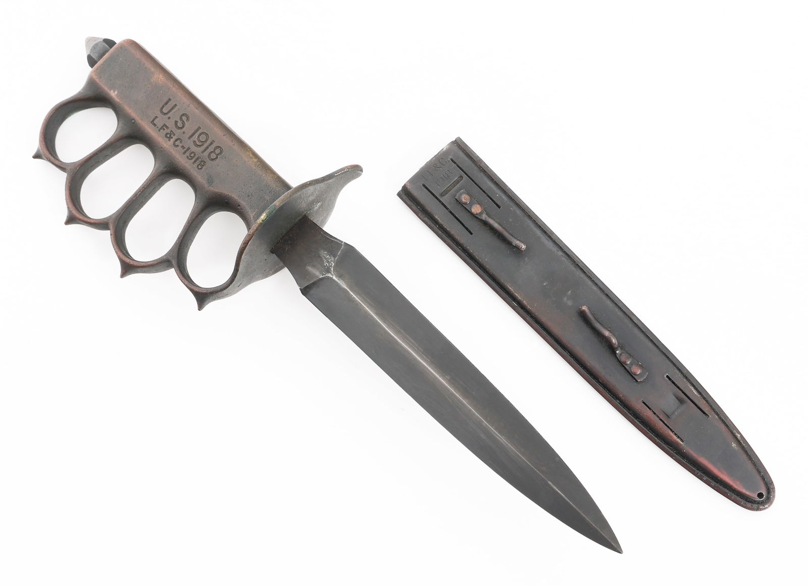 WWI US M1918 MARK I TRENCH KNIFE by L.F. & C.: WWI US M1918 MARK I TRENCH KNIFE by L.F. & C. WWI US Army M1918 Mark I Trench Knife. Double edged, blued blade. Solid brass handle maker marked by L.F. & C. with knuckle guard, and steel spike pommel.