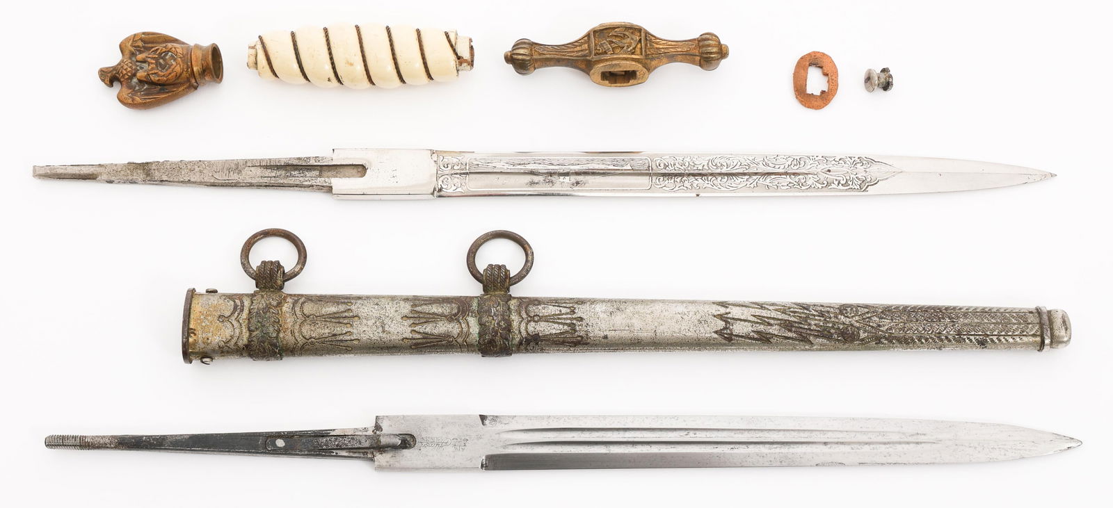 WWII GERMAN KRIEGSMARINE OFFICER DAGGER PARTS: WWII GERMAN KRIEGSMARINE OFFICER DAGGER PARTS WWII German Kriegsmarine Dagger Parts. Includes blade with U-Boat etching by Robert Klaas, Alexander Coppel blade with no etchings, crossguard, eagle pomm