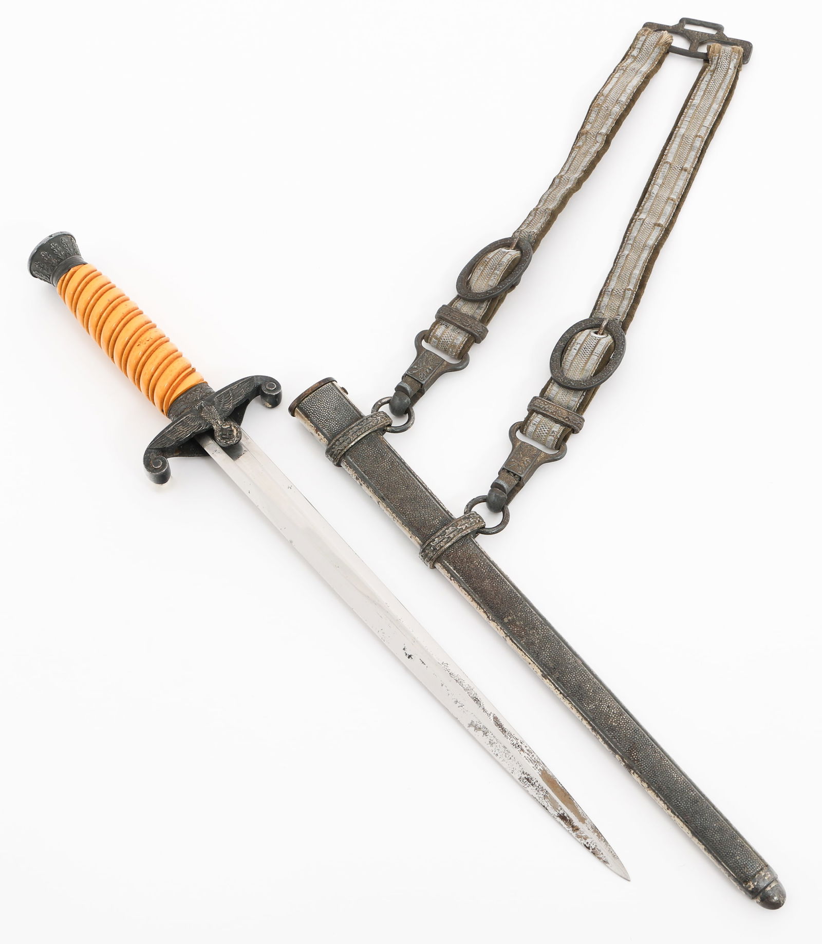 WWII GERMAN HEER M35 OFFICER DAGGER by WKC: WWII GERMAN HEER M35 OFFICER DAGGER by WKC WWII German Army Model 1935 Dress Dagger. Double edged, bright blade. Maker mark of WKC etched on the ricasso. Leather buffer pad present. Alloy based hilt,