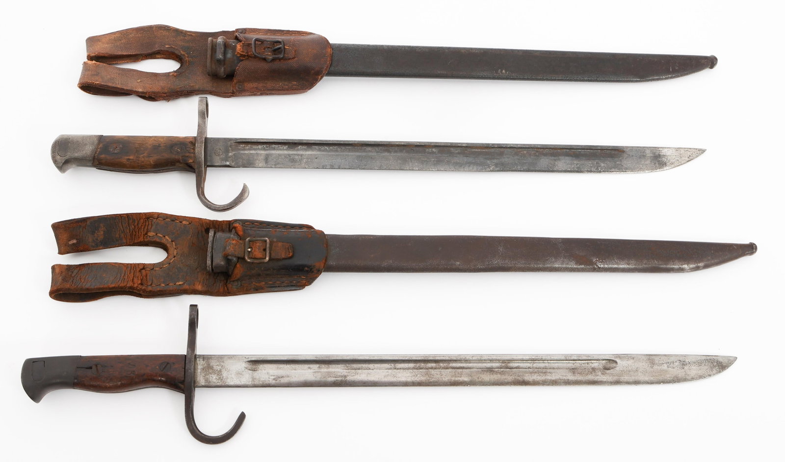 WWII IMPERIAL JAPANESE TYPE 30 BAYONETS: WWII IMPERIAL JAPANESE TYPE 30 BAYONETS WWII Imperial Japanese Type 30 Bayonets. (1) Type 30. Single edged blade with fuller. No visible marks. Steel hilt with wood grips. Steel scabbard with leather 