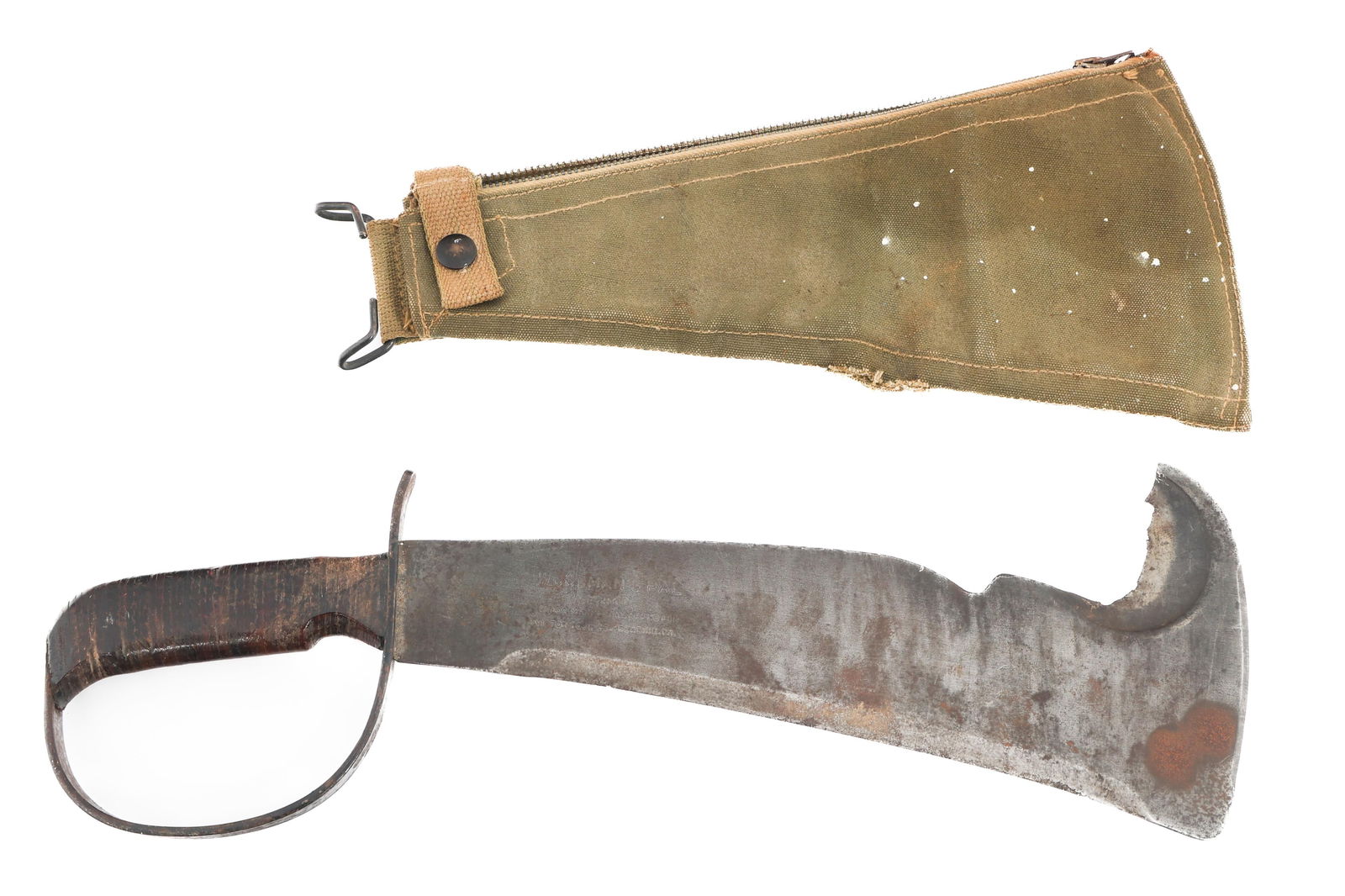 WWII US ARMY WOODSMAN'S PAL MACHETE: WWII US ARMY WOODSMAN'S PAL MACHETE WWII US Army Woodman's Pal Machete. Curved, multi-edged blade. Maker mark of "Woodsman's Pal, 284 Trademark, Victor Tool Co" stamped on the blade. Steel crossguard