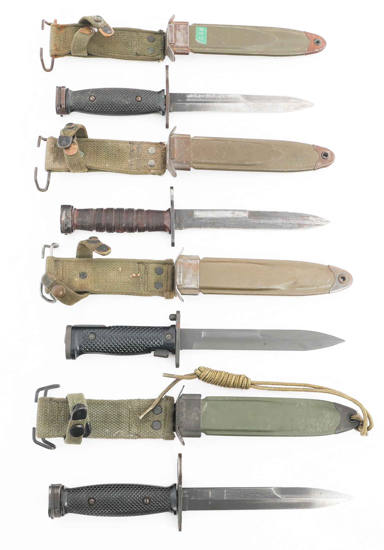 COLD WAR US ARMY M5A1, M7 & M4 BAYONETS: COLD WAR US ARMY M5A1, M7 & M4 BAYONETS Cold War US Army M5A1, M7 and Commercial M4 Bayonets. (1) M5A1. Single edged, parkerized blade. Maker marked by AK1. Steel hilt with composite grips. M8A1 scabb