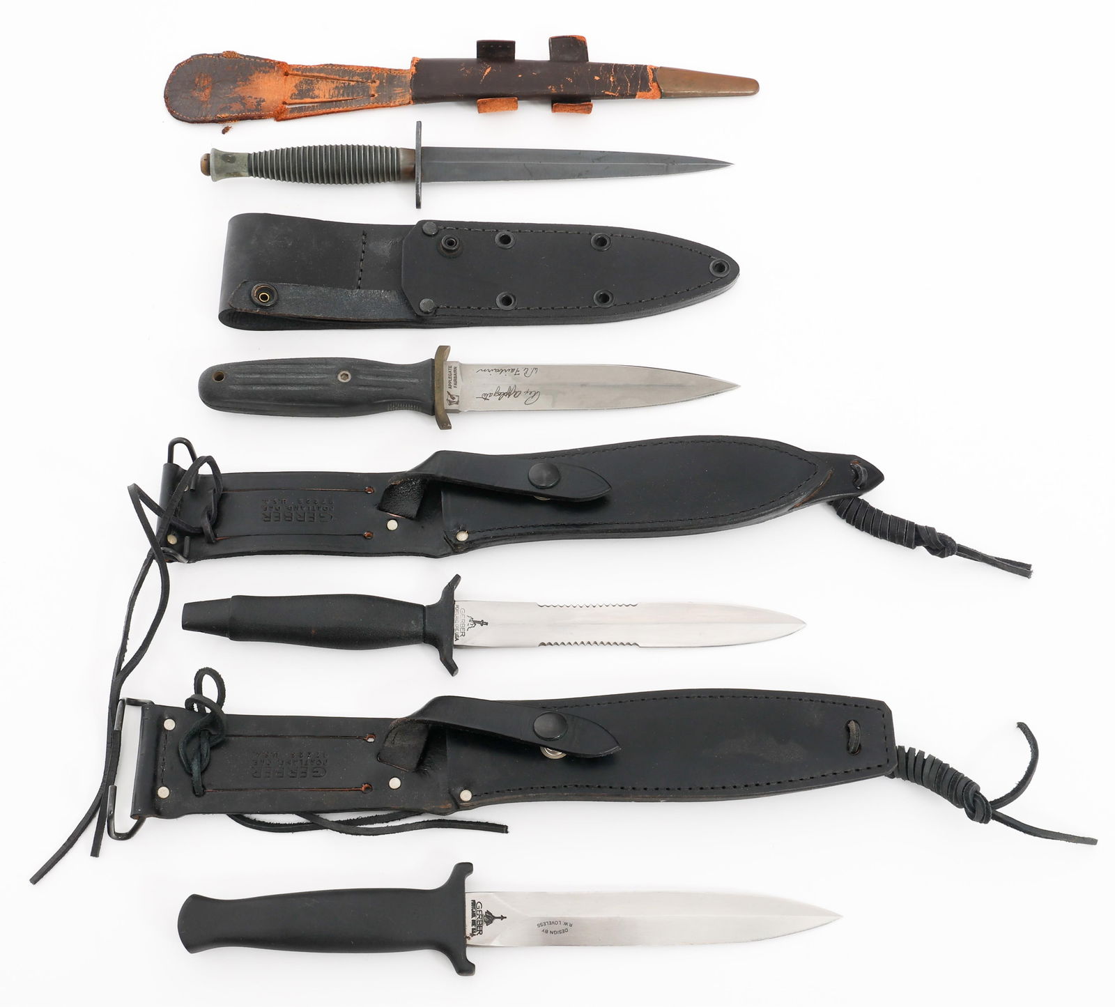 GERBER & FAIRBAIRN SYKES FIGHTING KNIVES & DAGGERS: GERBER & FAIRBAIRN SYKES FIGHTING KNIVES & DAGGERS Gerber and Fairbairn Sykes Fighting Knives and Daggers. (1) Gerber Guardian II. Black leather sheath, original commercial cardboard box and company l