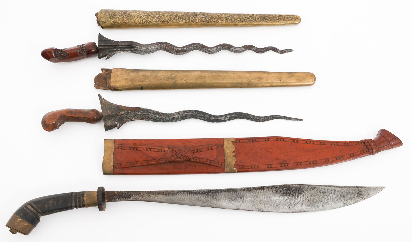 SOUTHEAST ASIAN KRIS DAGGERS & TALIBON: SOUTHEAST ASIAN KRIS DAGGERS & TALIBON Southeast Asian Kris Daggers and Talibon. (2) Kris Daggers. Double edged blades. Wood handles. Brass wrapped wooden scabbards. (1) Talibon. Single edged blade. W