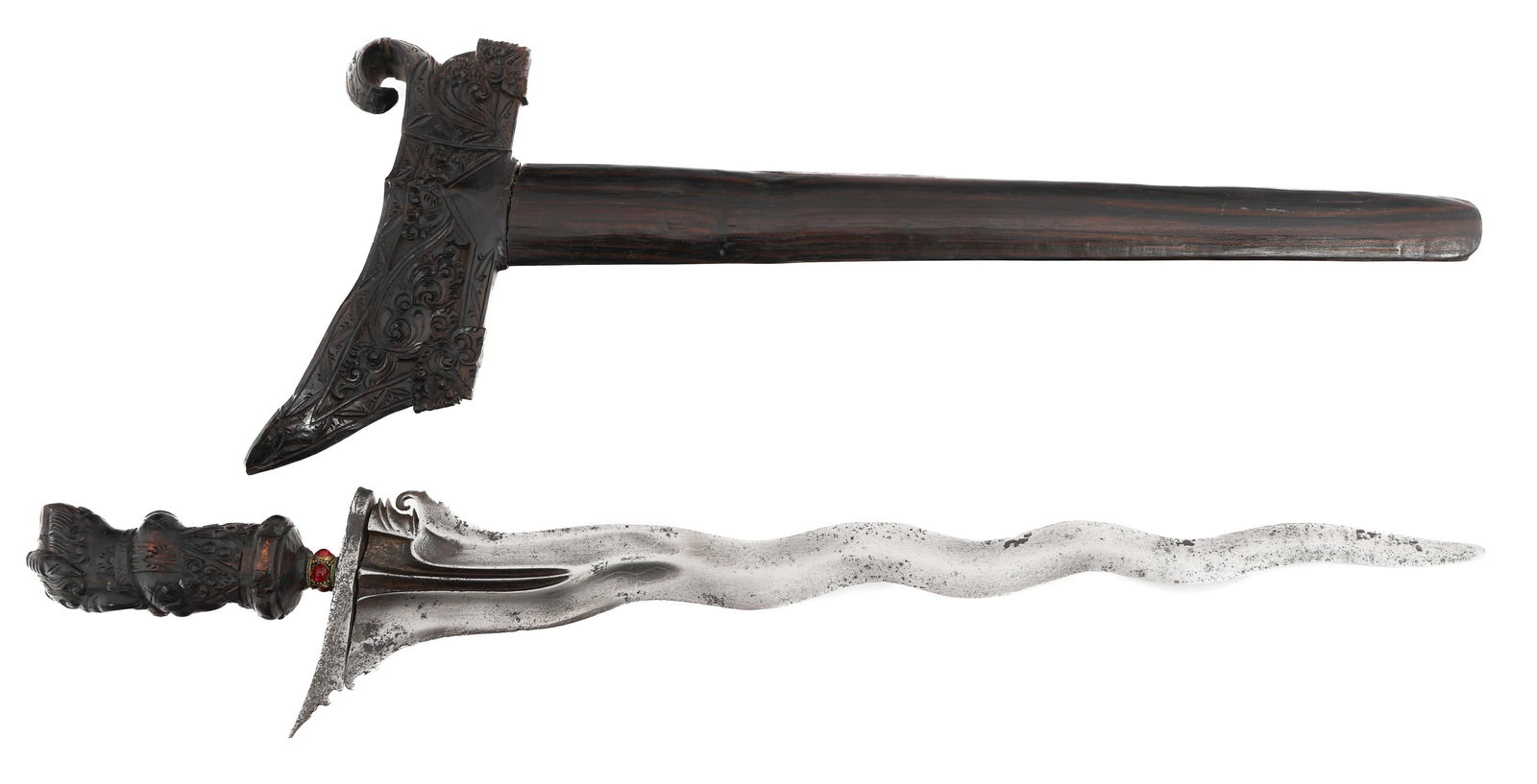 SOUTHEAST ASIAN KRIS DAGGER WITH SCABBARD: SOUTHEAST ASIAN KRIS DAGGER WITH SCABBARD Southeast Asian Kris Dagger. Double edged, wavy blade. No visible marks. Decorated wooden handle and scabbard. Blade Length: 16 1/8" Total Length: 20 1/2"