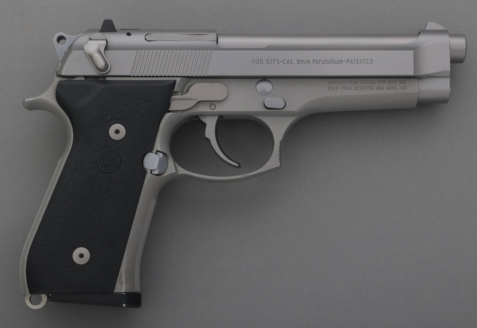 BERETTA MODEL 92FS 9x19mm CALIBER PISTOL: BERETTA MODEL 92FS 9x19mm CALIBER PISTOL Beretta Model 92 FS 9x19mm caliber semi automatic pistol. American flag and United We Stand engraved on left slide. Three dot sights. Rubber grips. Two magazin