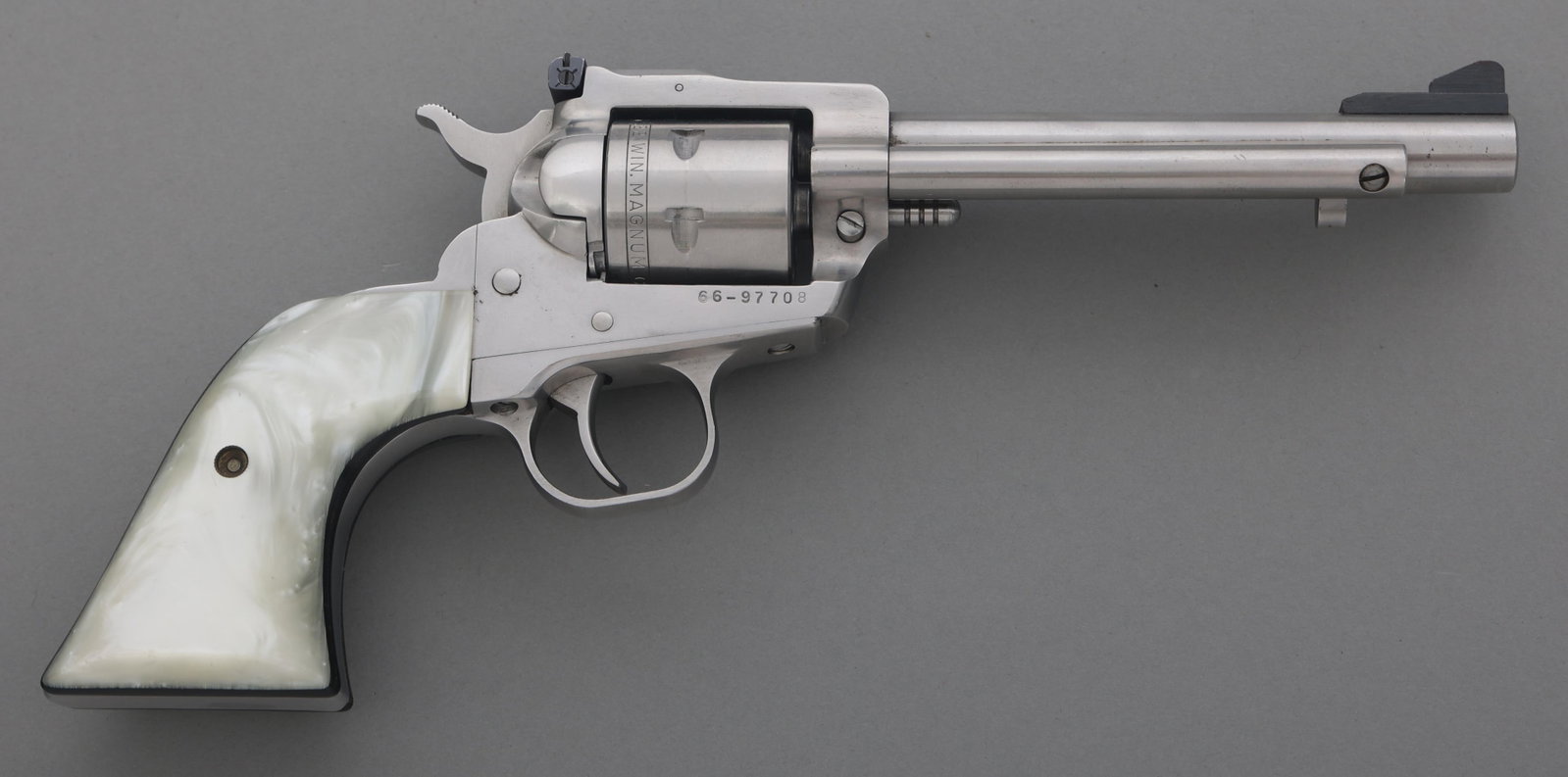 RUGER NEW MODEL SINGLE-SIX .22 WMR CAL SA REVOLVER: RUGER NEW MODEL SINGLE-SIX .22 WMR CAL SA REVOLVER Ruger New Model Single-Six .22 W.M.R. caliber SA revolver. Six-shot smooth cylinder. Composite grips. Blade front sight. Adjustable rear sight. Calib
