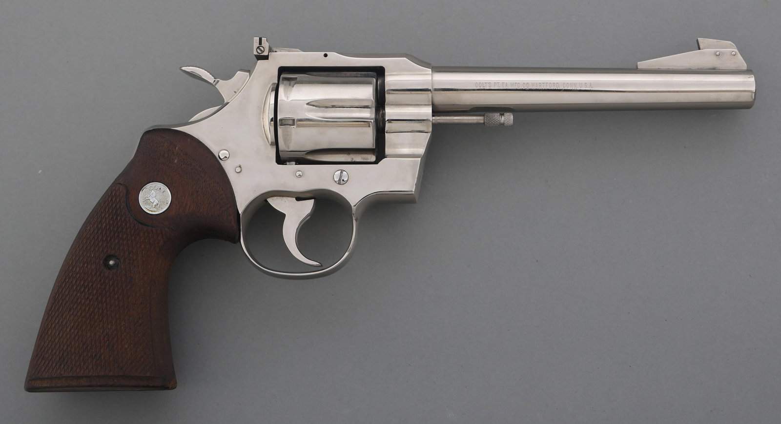 COLT OFFICERS MODEL MATCH .38 SPECIAL SA REVOLVER: COLT OFFICERS MODEL MATCH .38 SPECIAL SA REVOLVER Colt Officer's Model Match .38 Special caliber SA revolver. Six-shot fluted cylinder. Checkered wood grips with Colt medallions. Blade front sight. Ad
