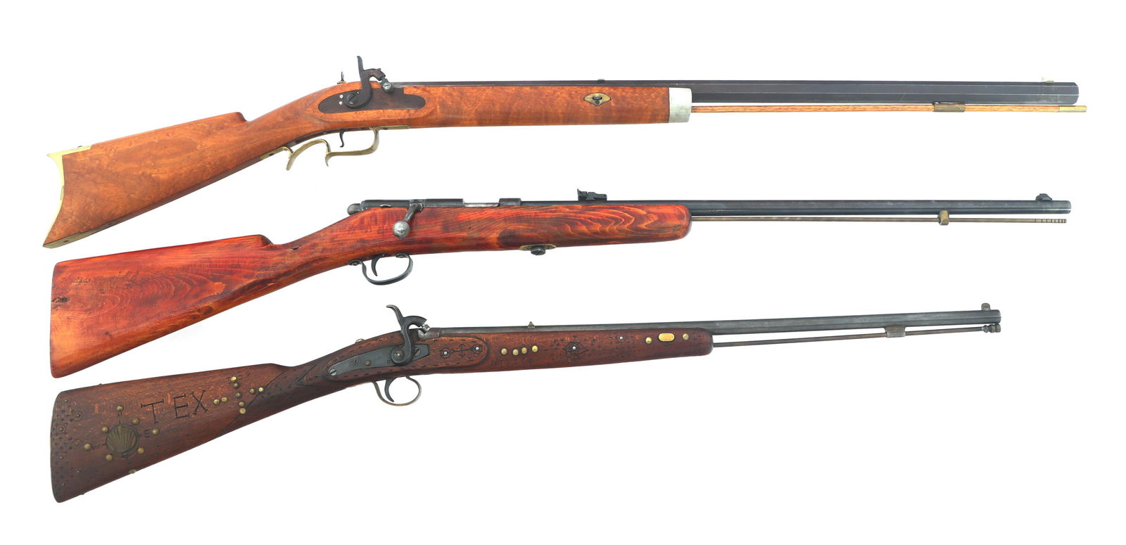 PERCUSSION RIFLES AND PERCUSSION SHOTGUN: PERCUSSION RIFLES AND PERCUSSION SHOTGUN Percussion rifles and percussion shotgun. A) .44 caliber percussion rifle. Blued finish. Brass trigger guard and butt plate. Rear peep sight. Wood stock with c