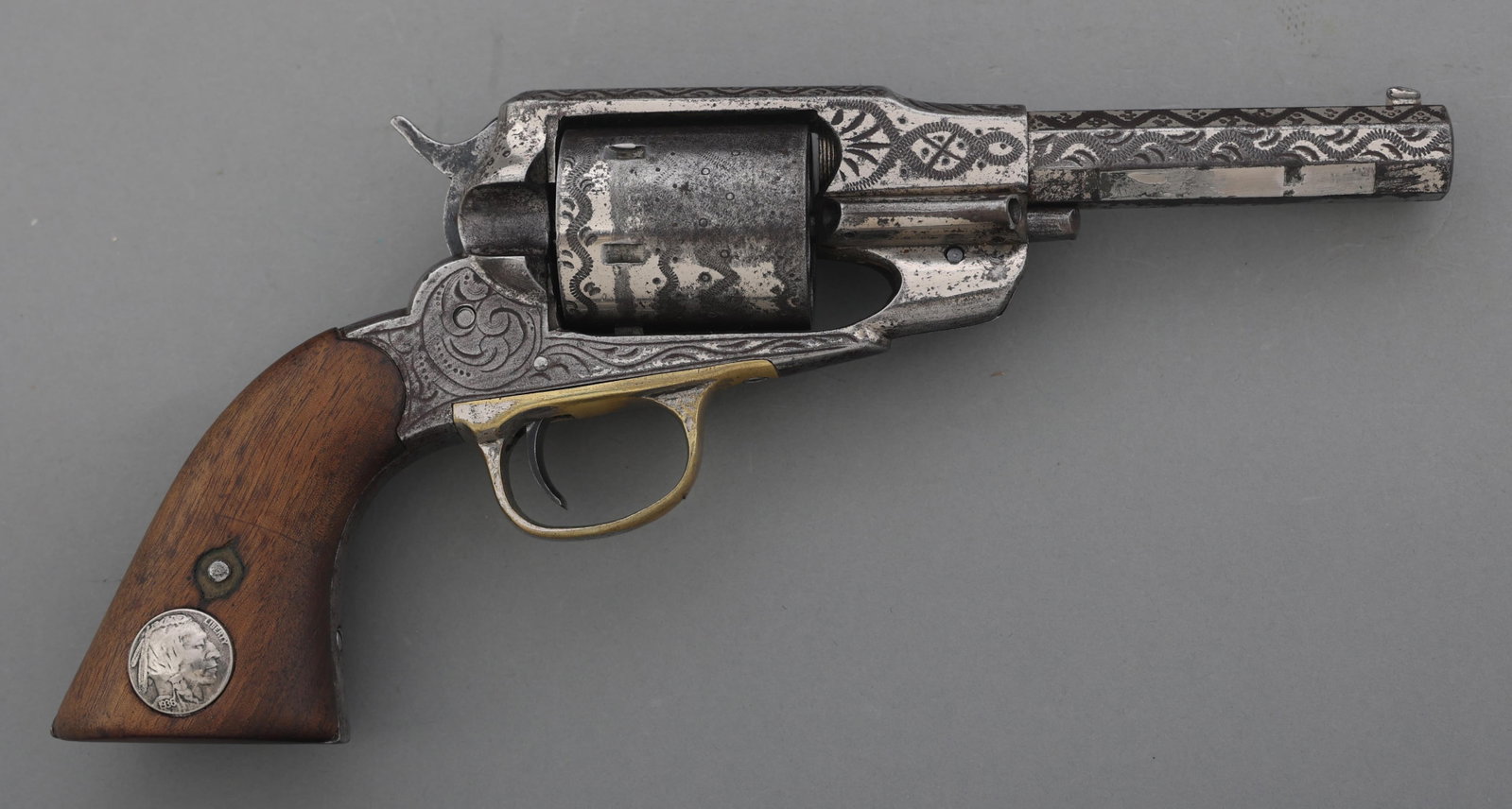 REMINGTON NEW MODEL ARMY CONVERSION REVOLVER: REMINGTON NEW MODEL ARMY CONVERSION REVOLVER Engraved Remington New Model Army .45 Colt caliber centerfire conversion SA revolver. Cut down 5 inch octagonal barrel. Six-shot smooth cylinder. Engraved 