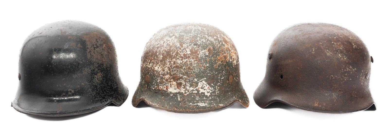 WWII GERMAN DUG RELIC FIREMAN & COMBAT HELMETS: WWII GERMAN DUG RELIC FIREMAN & COMBAT HELMETS WWII German and Austrian Dug Relic Helmets. (1) Fireman Helmet. Complete liner. (1) Winter Camo M40. Partial liner present. (1) German M40. No liner. Hol