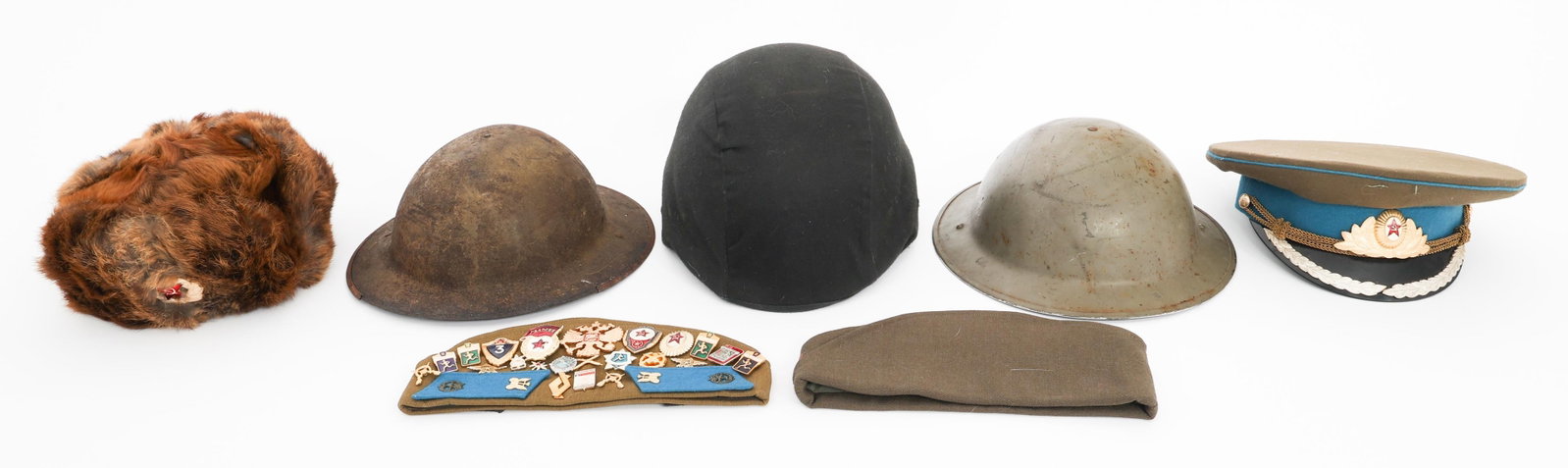 WWI - CURRENT WORLD MILITARY HEADGEAR: WWI - CURRENT WORLD MILITARY HEADGEAR WWI - Current World Military Headgear. Includes British MkI Helmet without liner and MkII Helmet with liner. Soviet fur ushanka. Officer visor cap. Garrison cap w