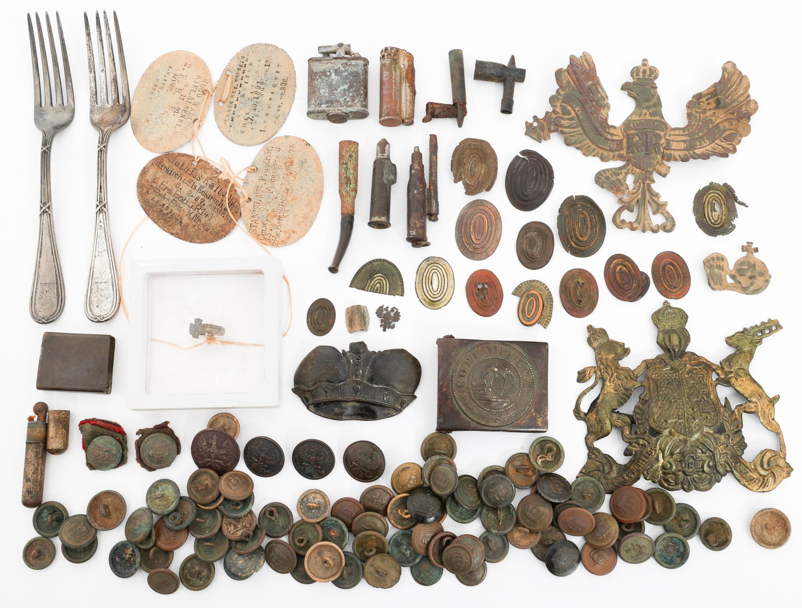 WWI IMPERIAL GERMAN & RUSSIAN DUG RELICS: WWI IMPERIAL GERMAN & RUSSIAN DUG RELICS WWI Imperial German & Russian Dug Relics. Includes pickelhaube front plates, Russian cap badges, tunic buttons, trench lighters, enlisted belt buckle, dog tags