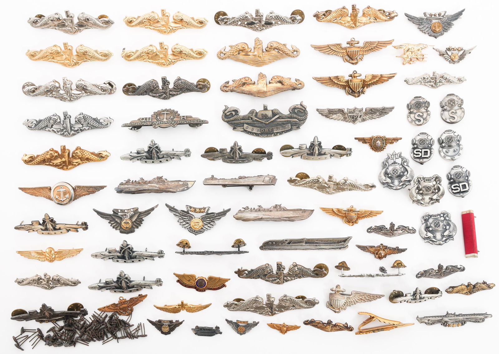 WWII - COLD WAR US NAVY BADGES: WWII - COLD WAR US NAVY BADGES WWII - Cold War US Navy Badges. Includes Submarine Warfare, USMC & Naval aviator wings, Flight Surgeon wings, USMC Combat Air Crew, Navy Observer wings, SEAL trident bad